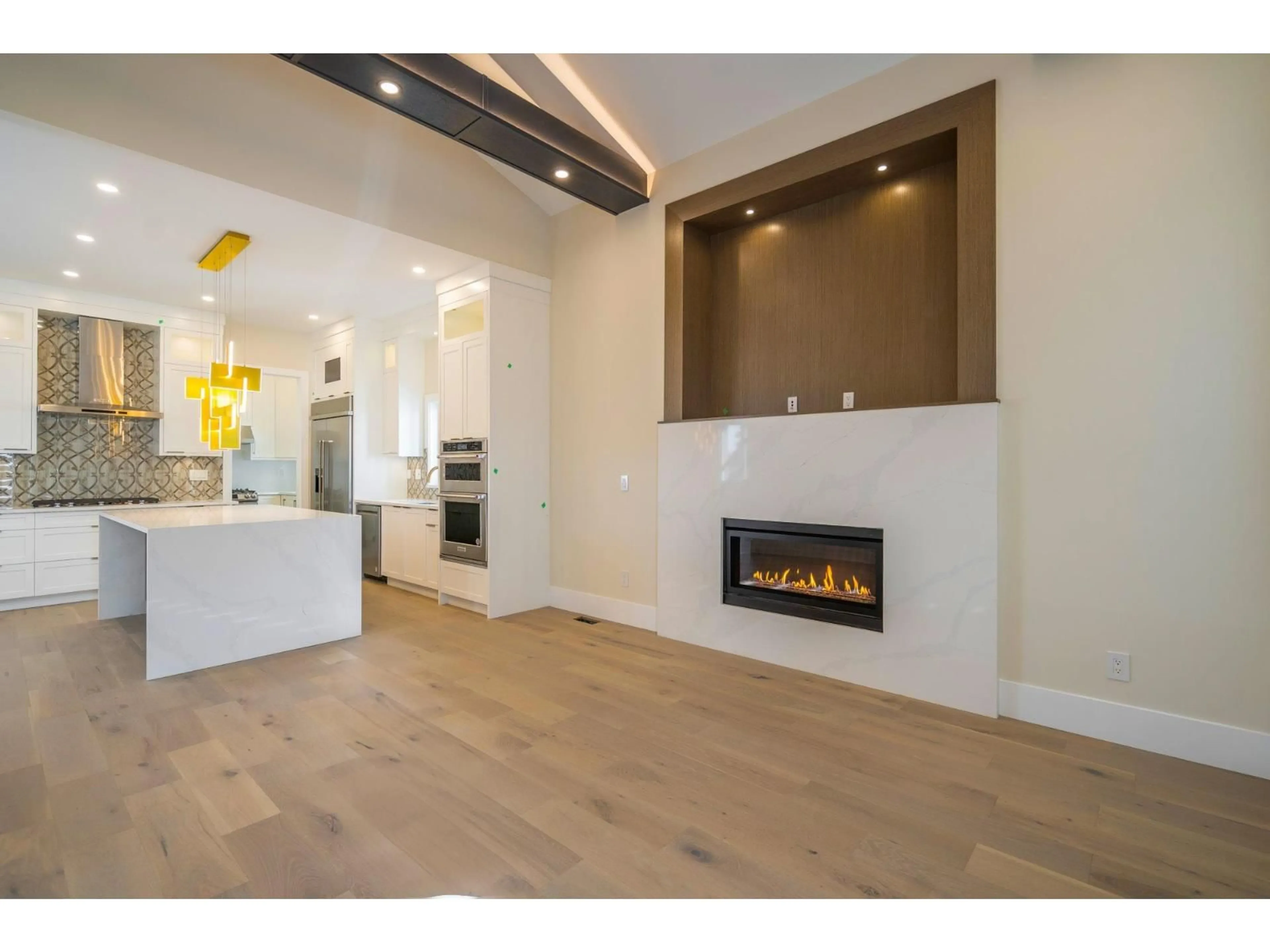 Open concept kitchen, wood/laminate floor for 16548 22 AVENUE, Surrey British Columbia V3Z0V5
