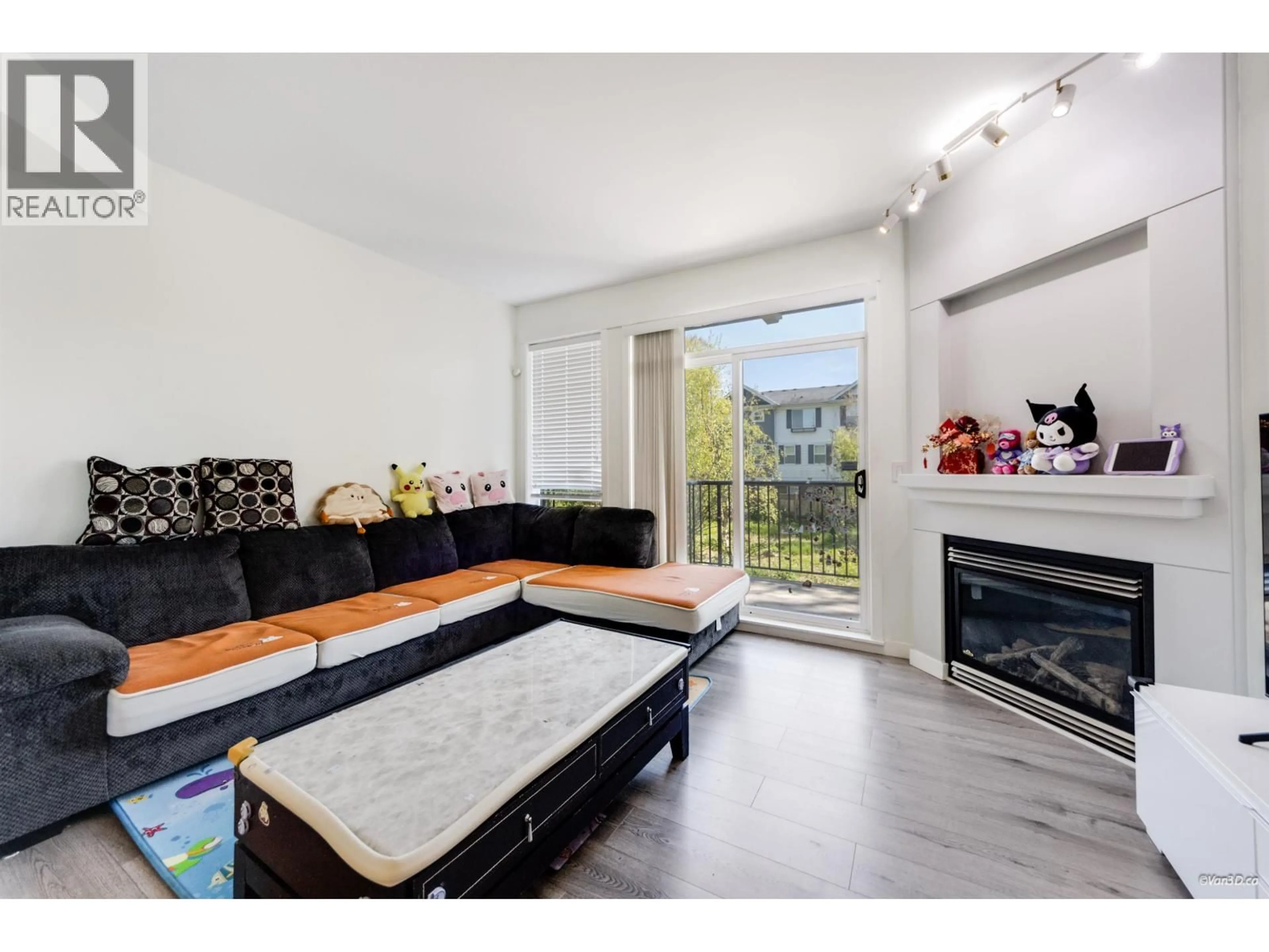 Living room with furniture, wood/laminate floor for 27 - 6300 ALDER STREET, Richmond British Columbia V6Y4G5