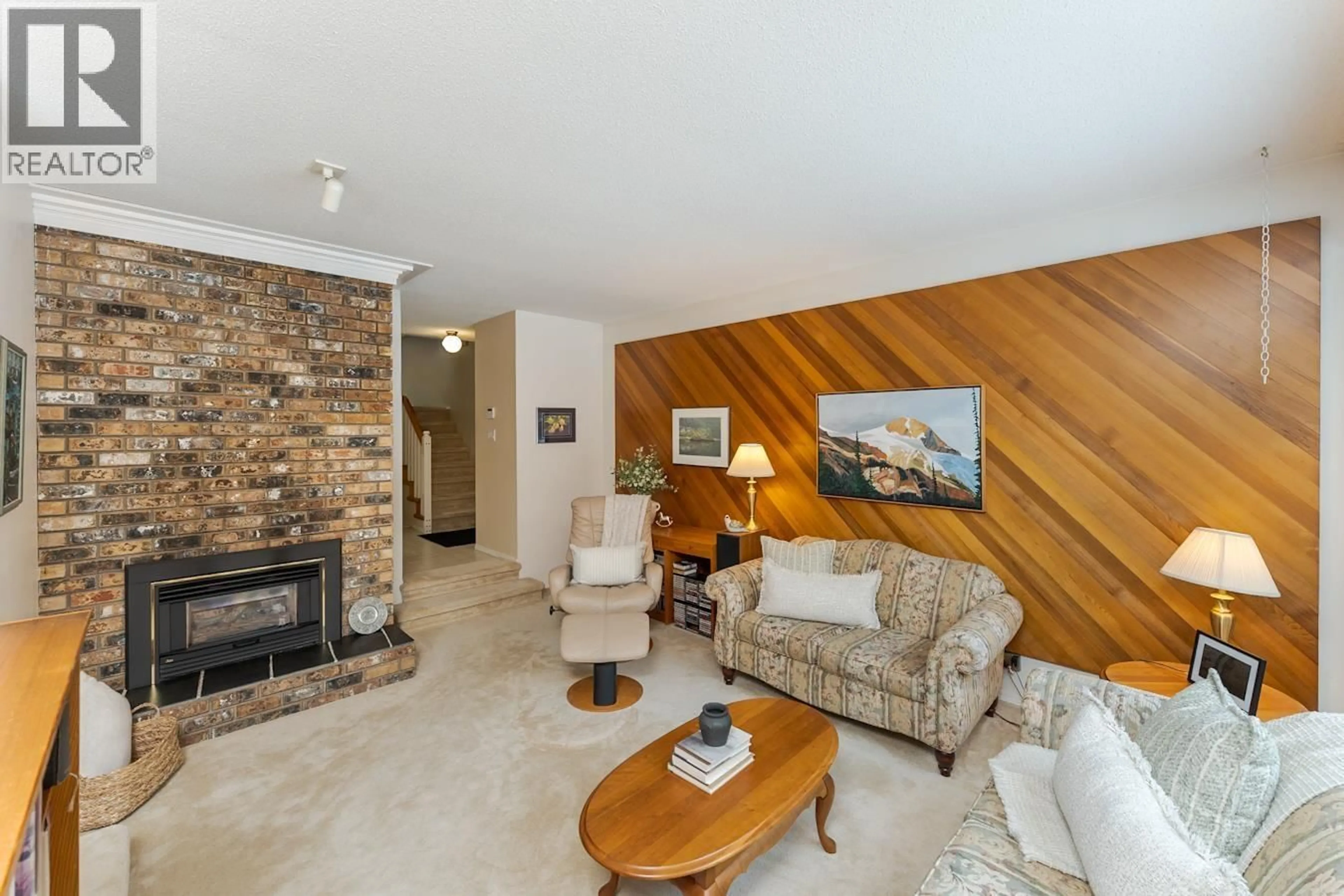 Living room with furniture, wood/laminate floor for 3655 RIVERVIEW ROAD, Prince George British Columbia V2K4Y7
