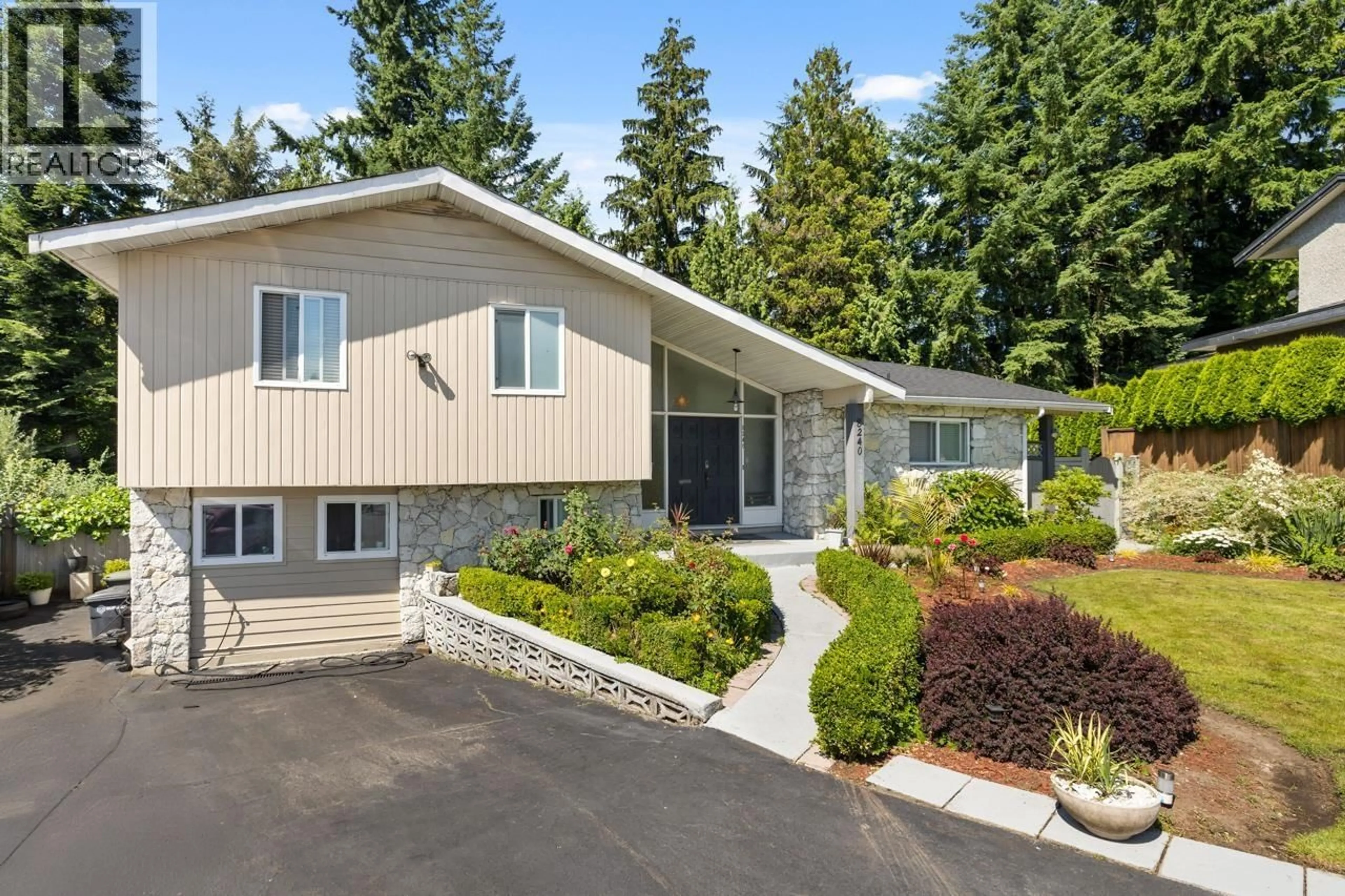 Home with vinyl exterior material, street for 8240 MANSON DRIVE, Burnaby British Columbia V5A2C2