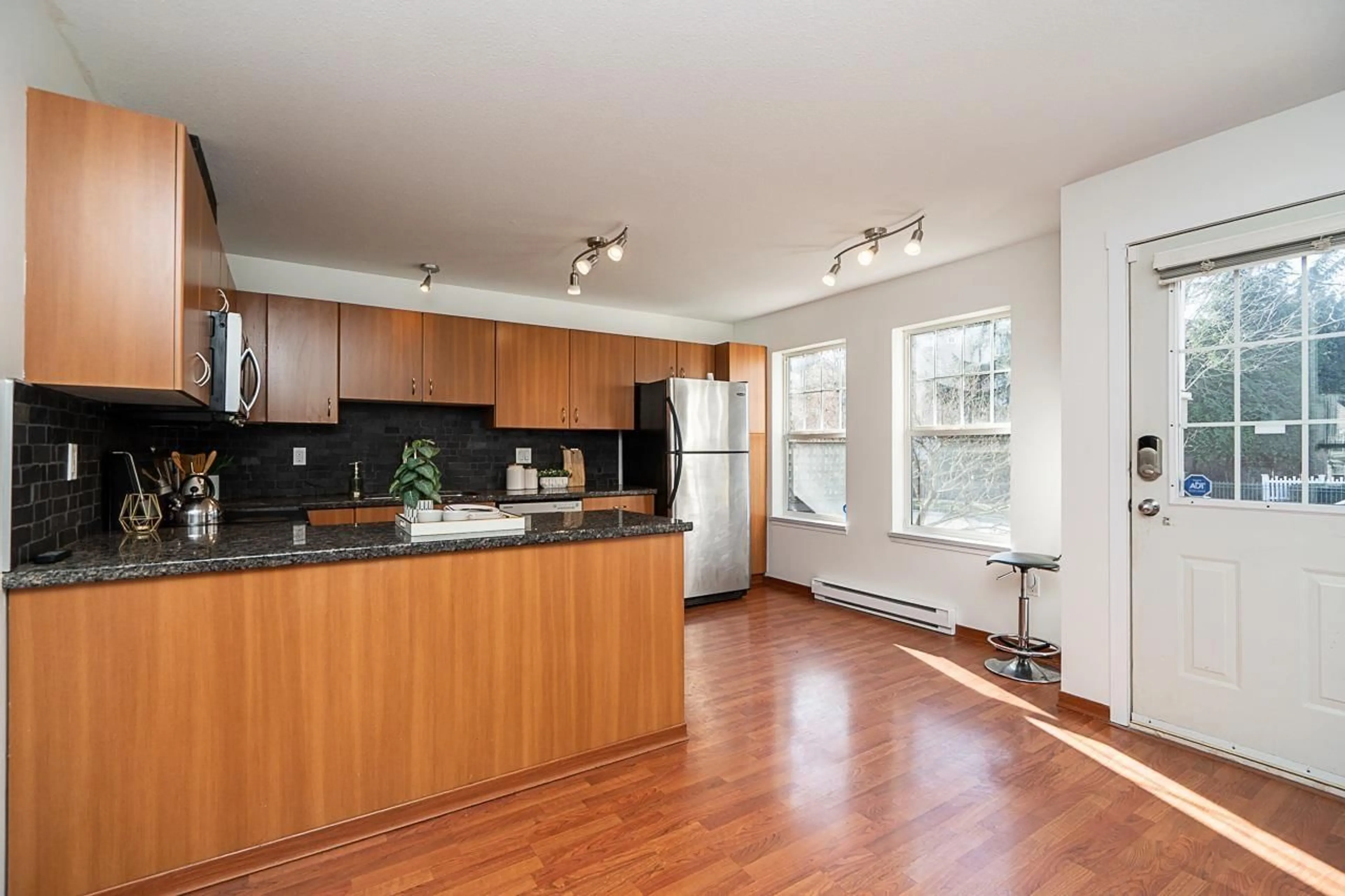 Open concept kitchen, wood/laminate floor for 5 - 8638 159 STREET, Surrey British Columbia V4N5P7