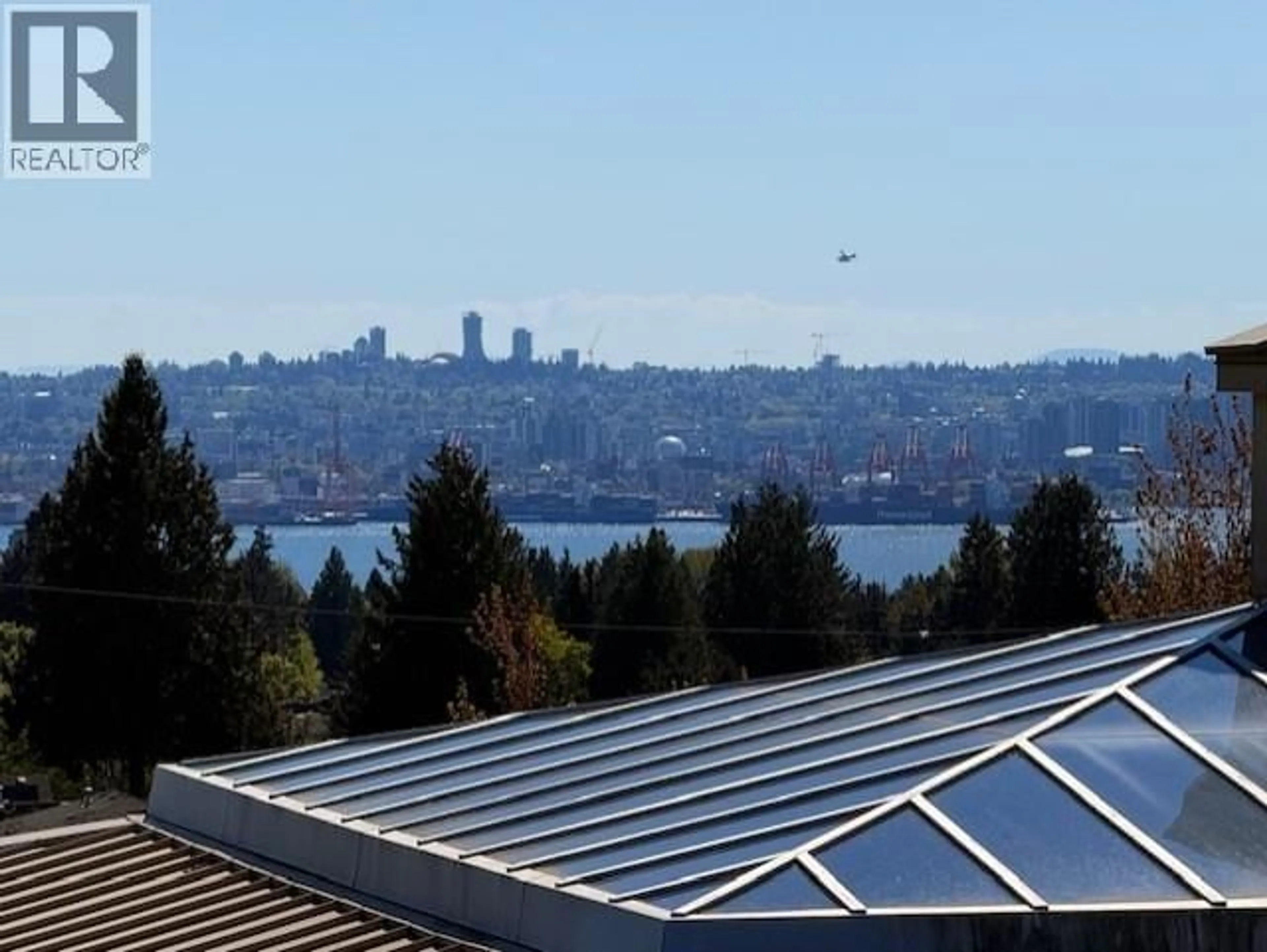 A pic from outside/outdoor area/front of a property/back of a property/a pic from drone, water/lake/river/ocean view for 322 - 121 29 STREET, North Vancouver British Columbia V7N4L6