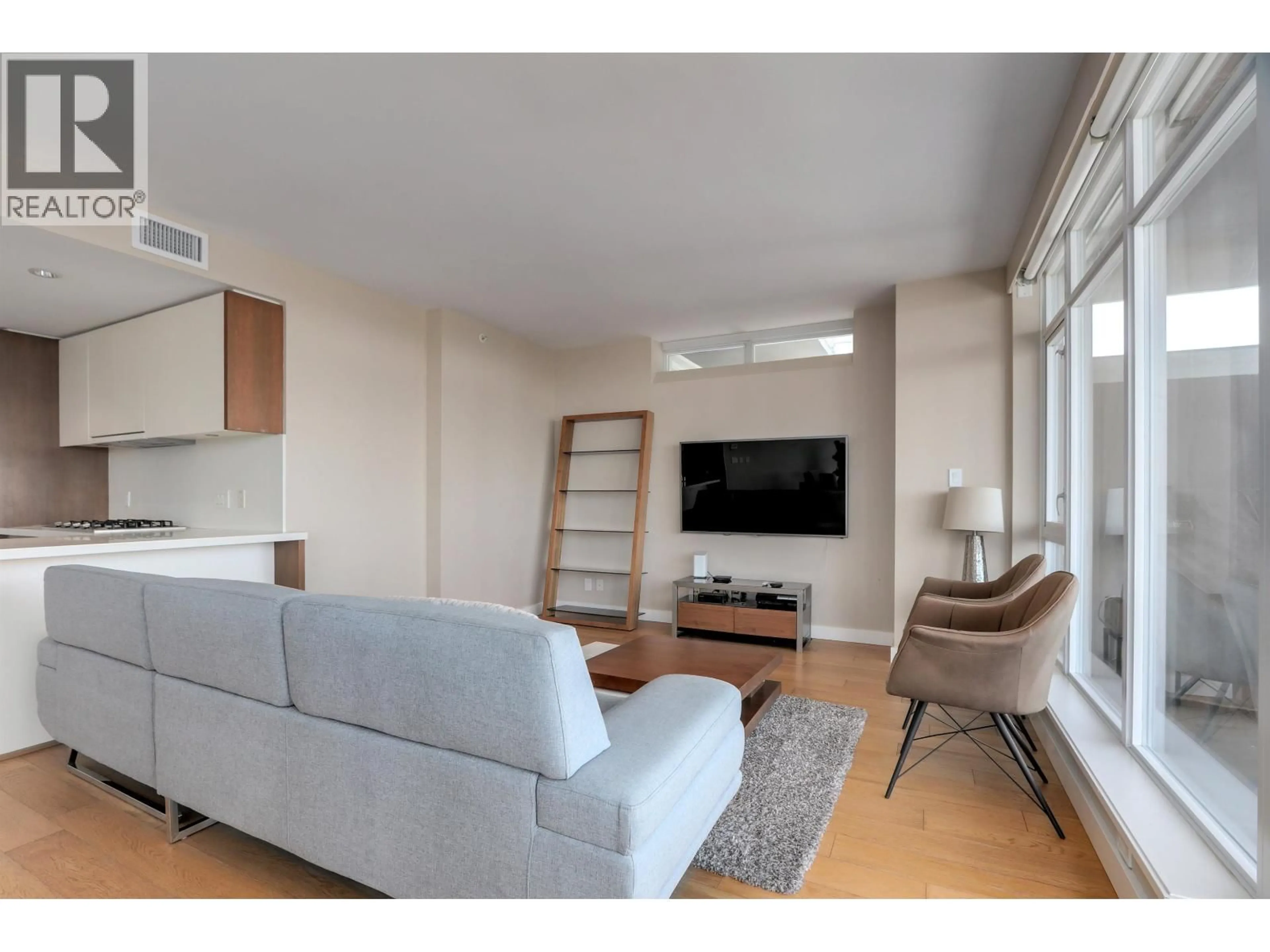 Living room with furniture, wood/laminate floor for 3501 - 1372 SEYMOUR STREET, Vancouver British Columbia V6B0L1