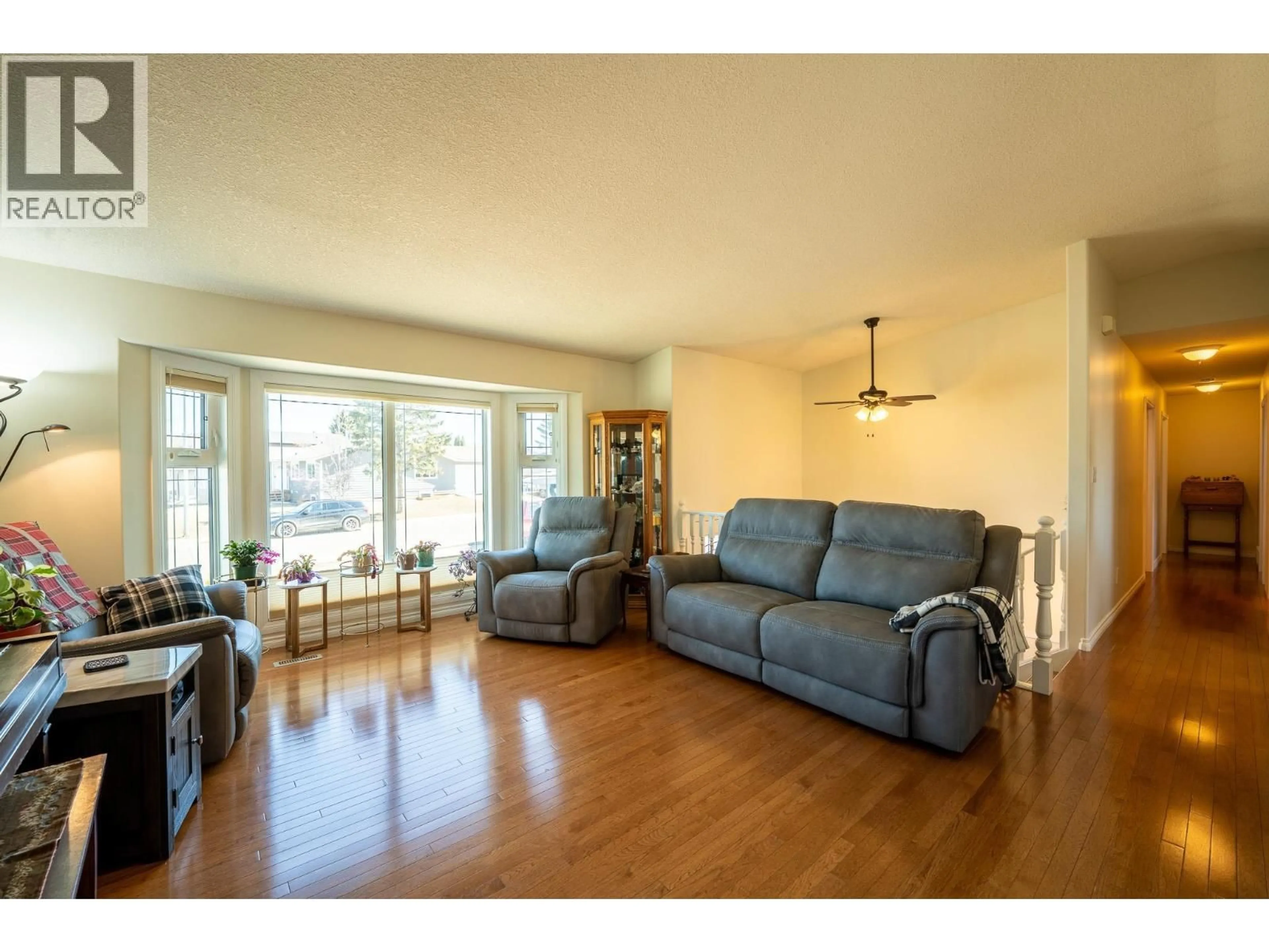 Living room with furniture, wood/laminate floor for 11316 106 STREET, Fort St. John British Columbia V1J6H6