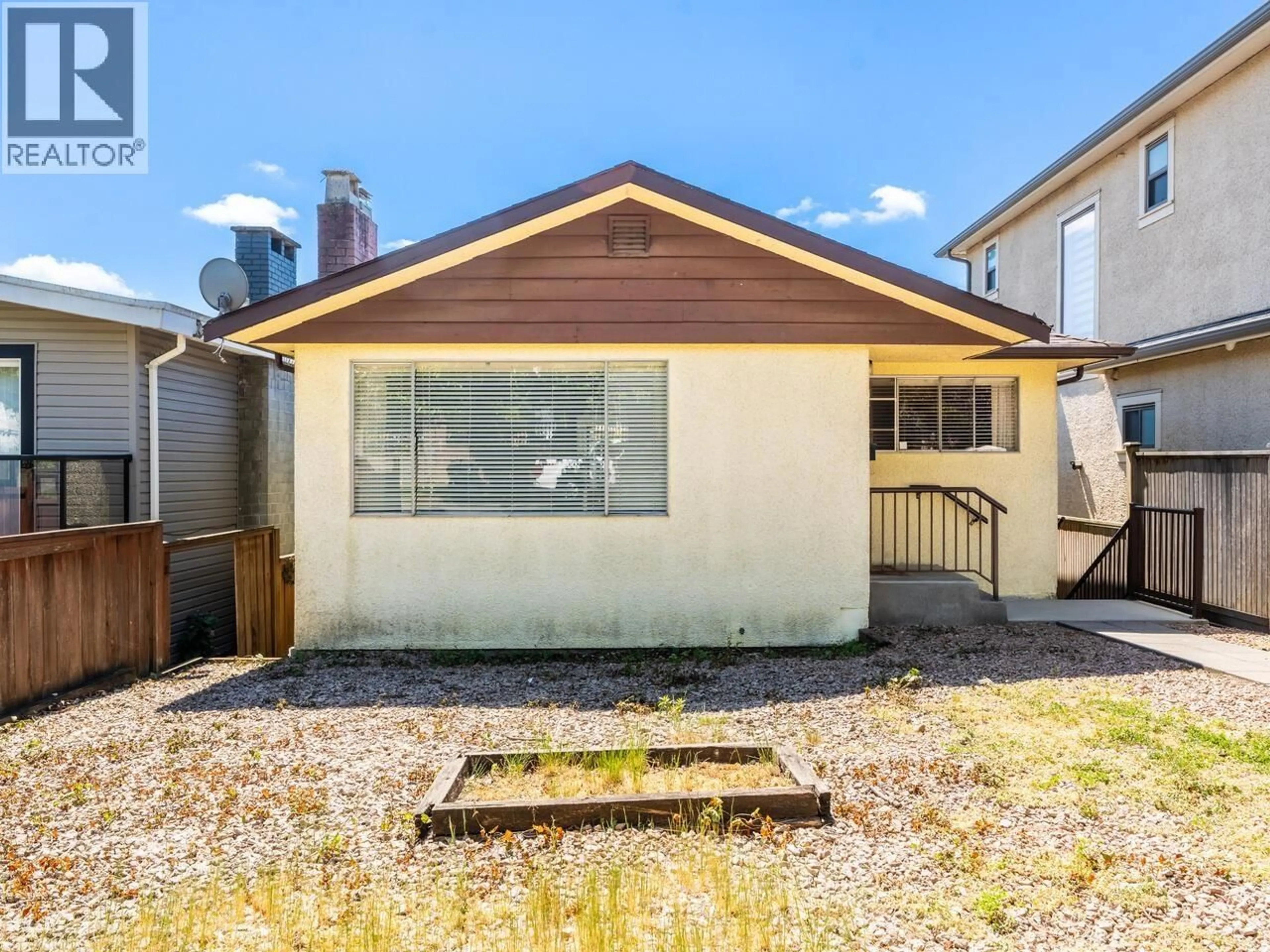 Home with vinyl exterior material, street for 1066 63RD AVENUE, Vancouver British Columbia V5X2L1