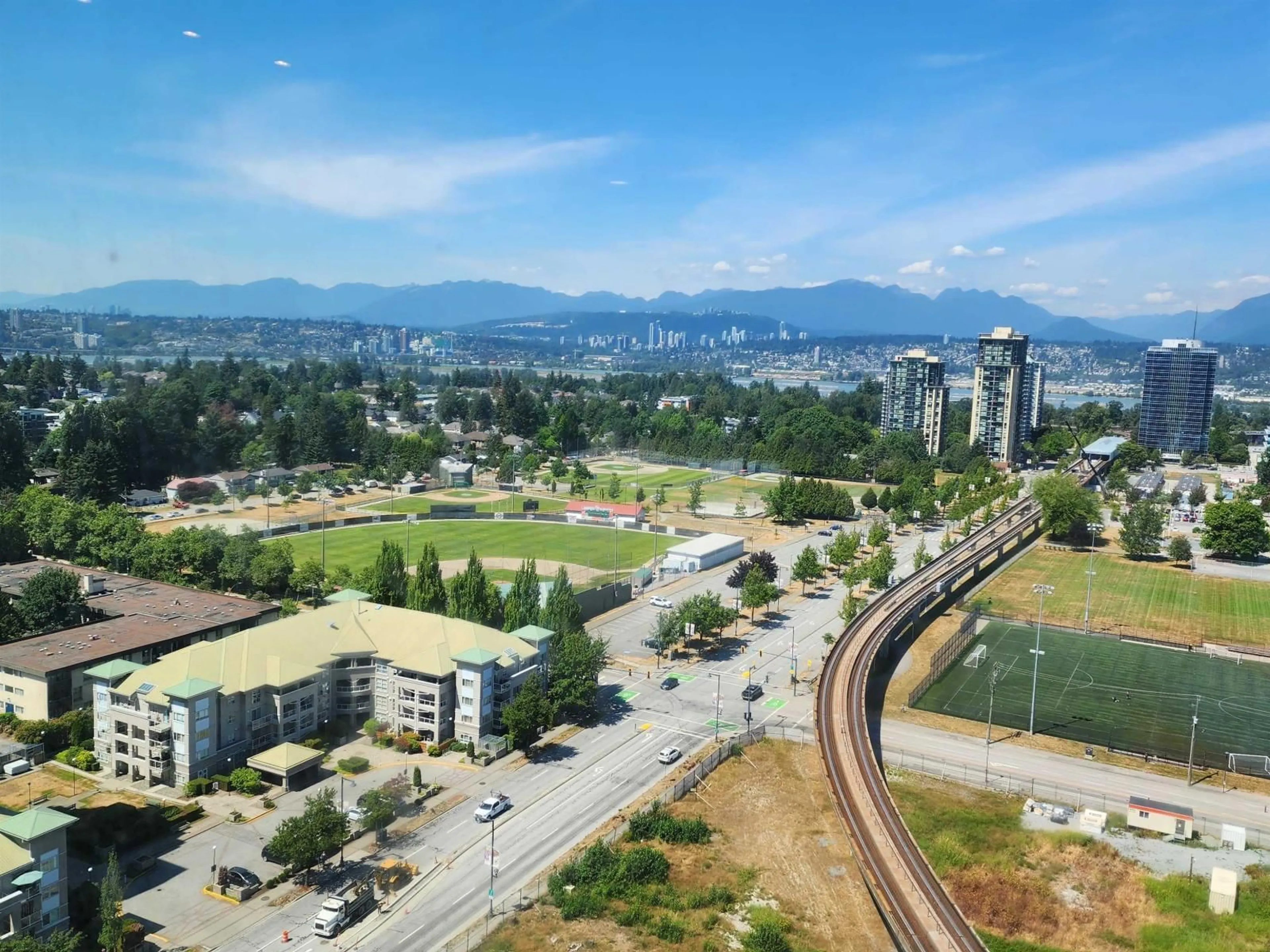 A pic from outside/outdoor area/front of a property/back of a property/a pic from drone, mountain view for 2204 - 13428 105 AVENUE, Surrey British Columbia V3T0S6