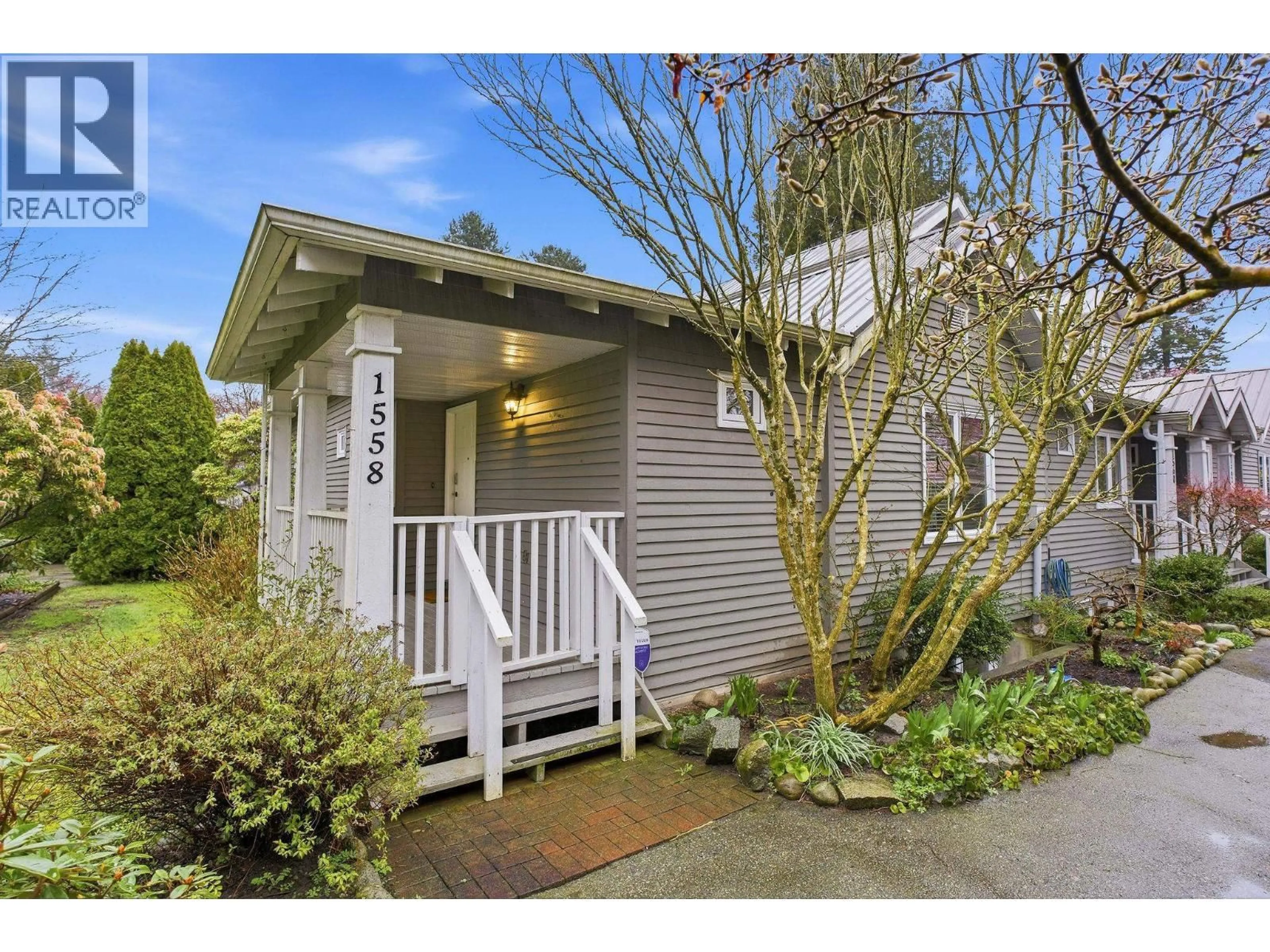Home with vinyl exterior material, street for 1558 BOWSER AVENUE, North Vancouver British Columbia V7P2Y3