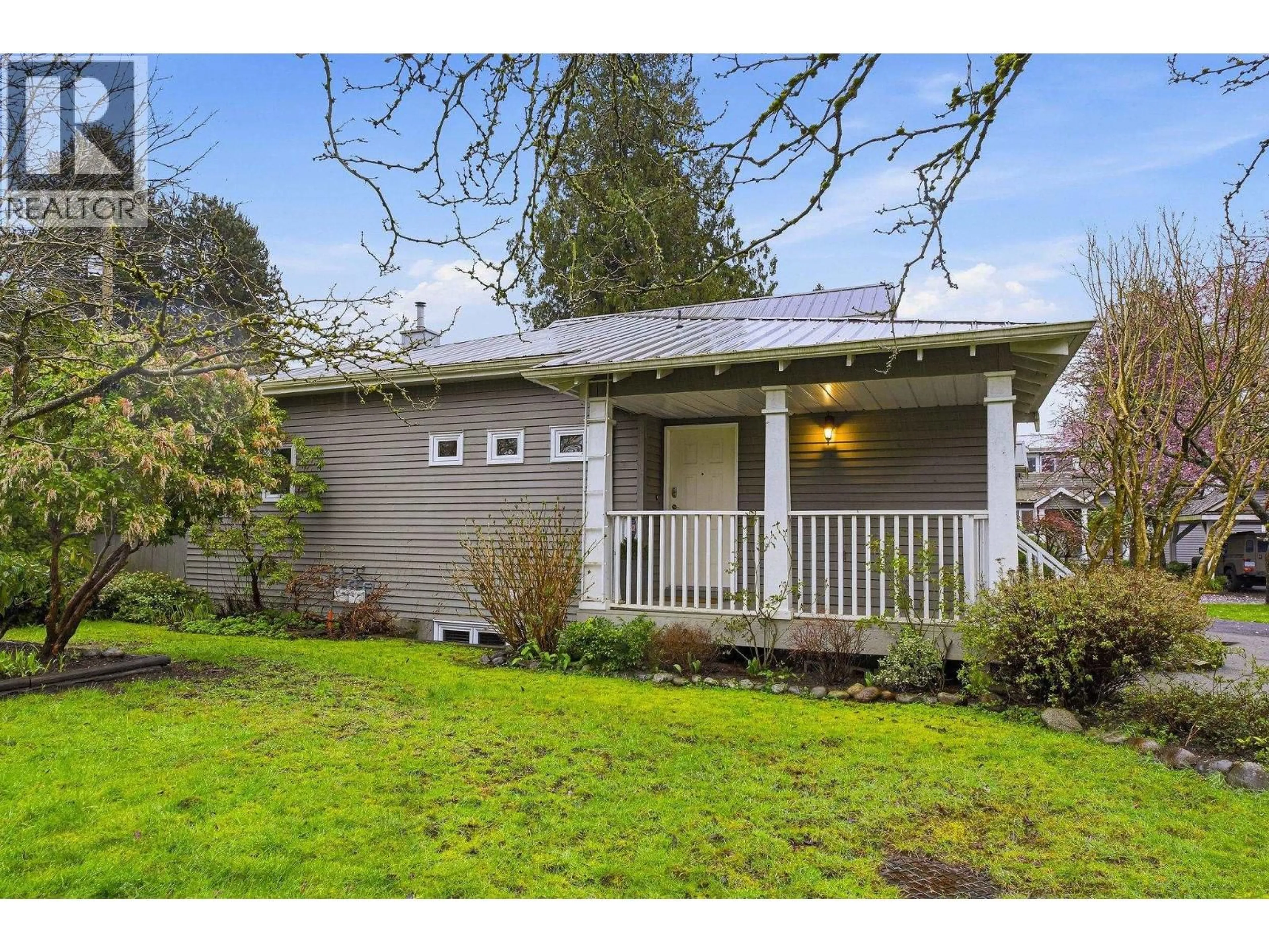 Home with vinyl exterior material, street for 1558 BOWSER AVENUE, North Vancouver British Columbia V7P2Y3