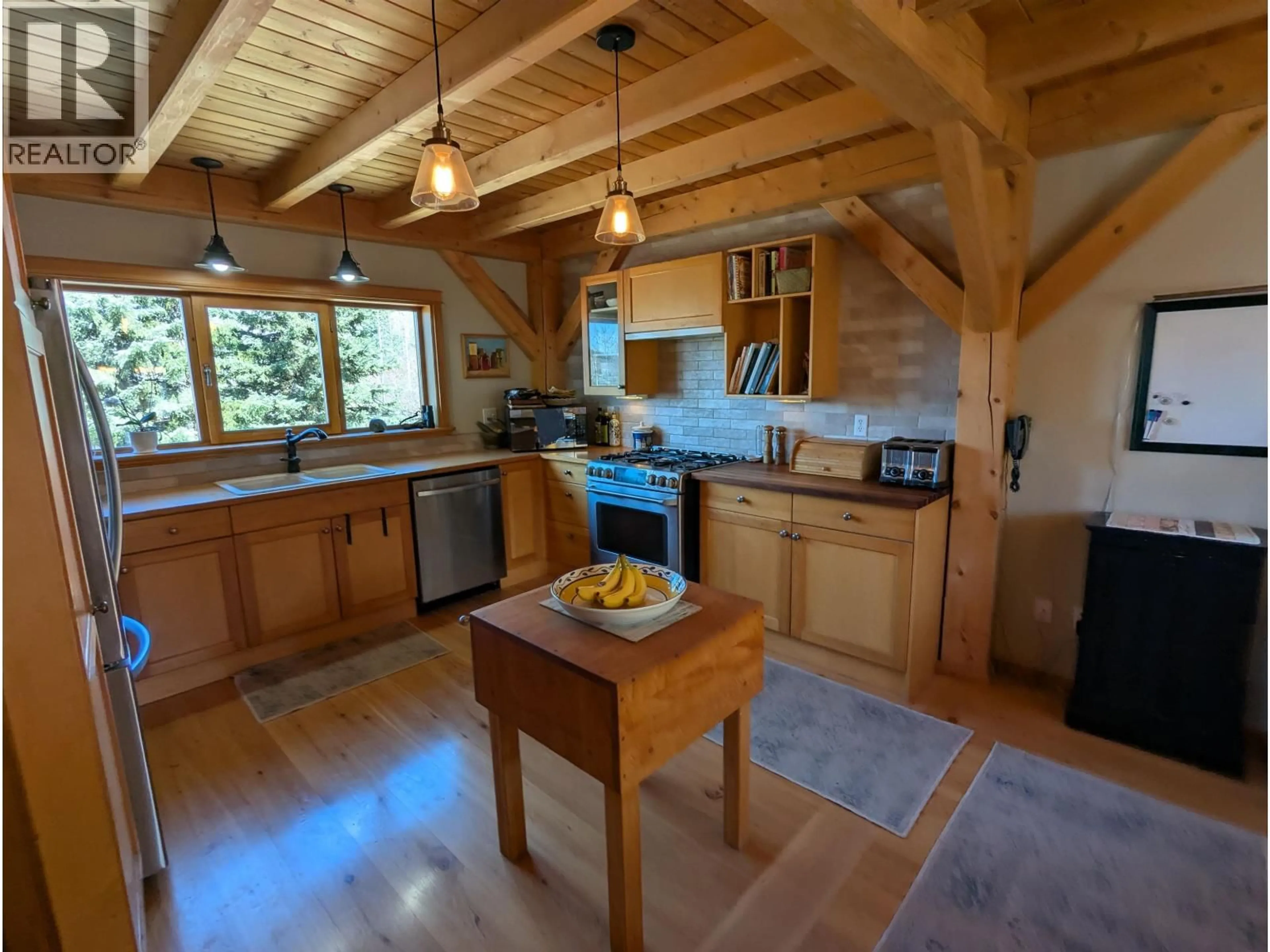 Open concept kitchen, wood/laminate floor for 8839 BLUFF ROAD, Telkwa British Columbia V0J2N0