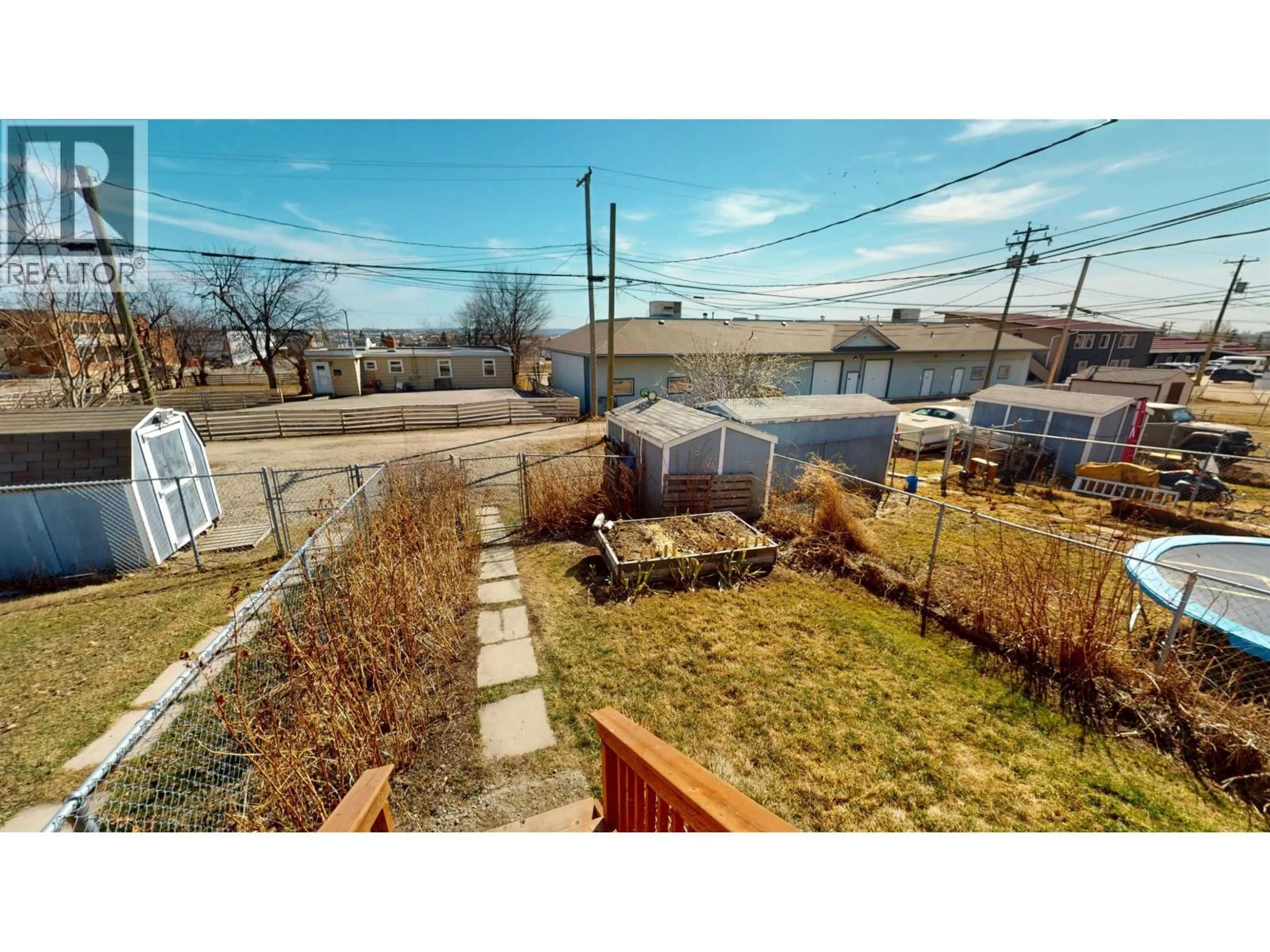 A pic from outside/outdoor area/front of a property/back of a property/a pic from drone, street for 10219 102 AVENUE, Fort St. John British Columbia V1J2E4