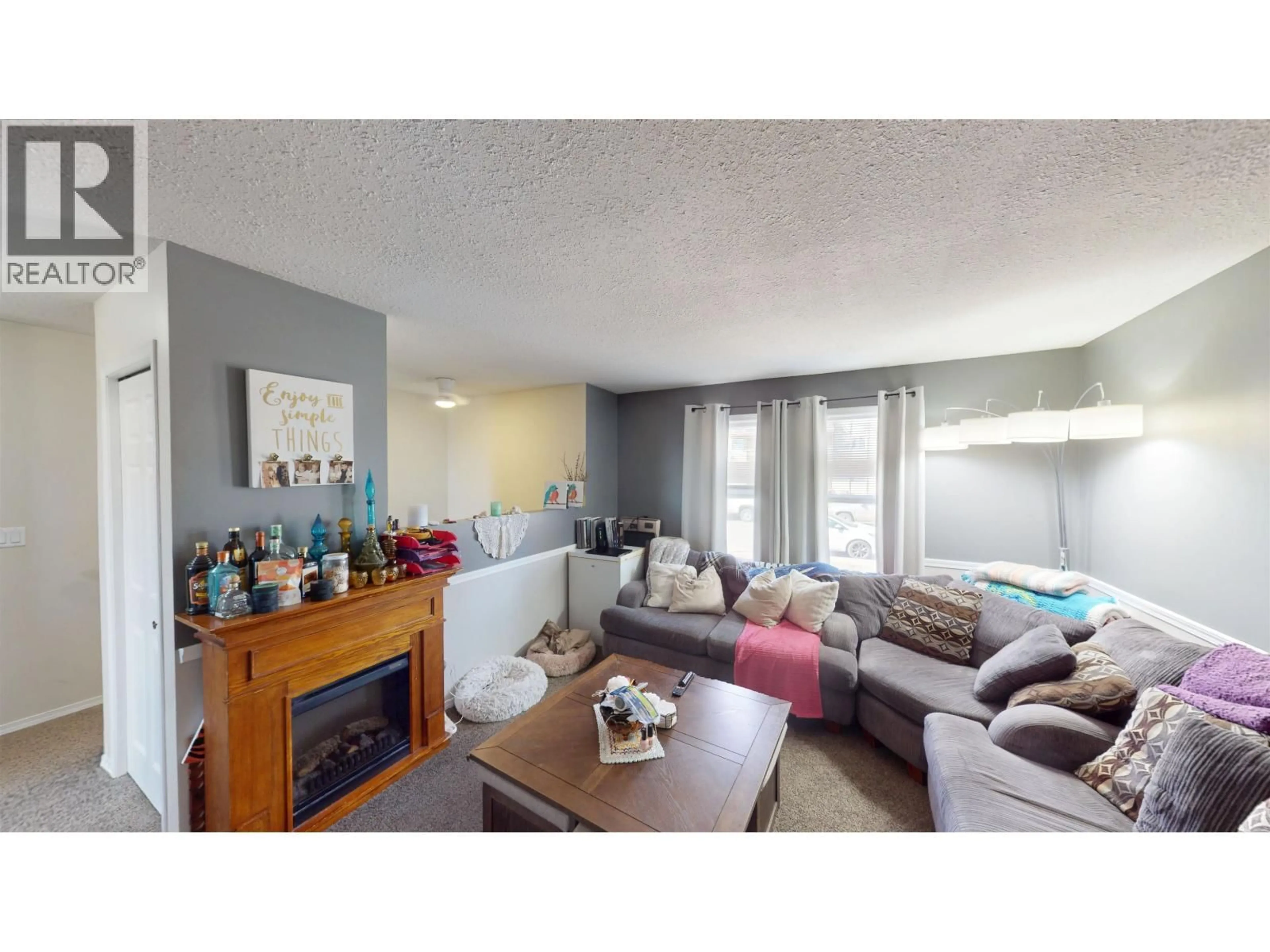 Living room with furniture, unknown for 10219 102 AVENUE, Fort St. John British Columbia V1J2E4