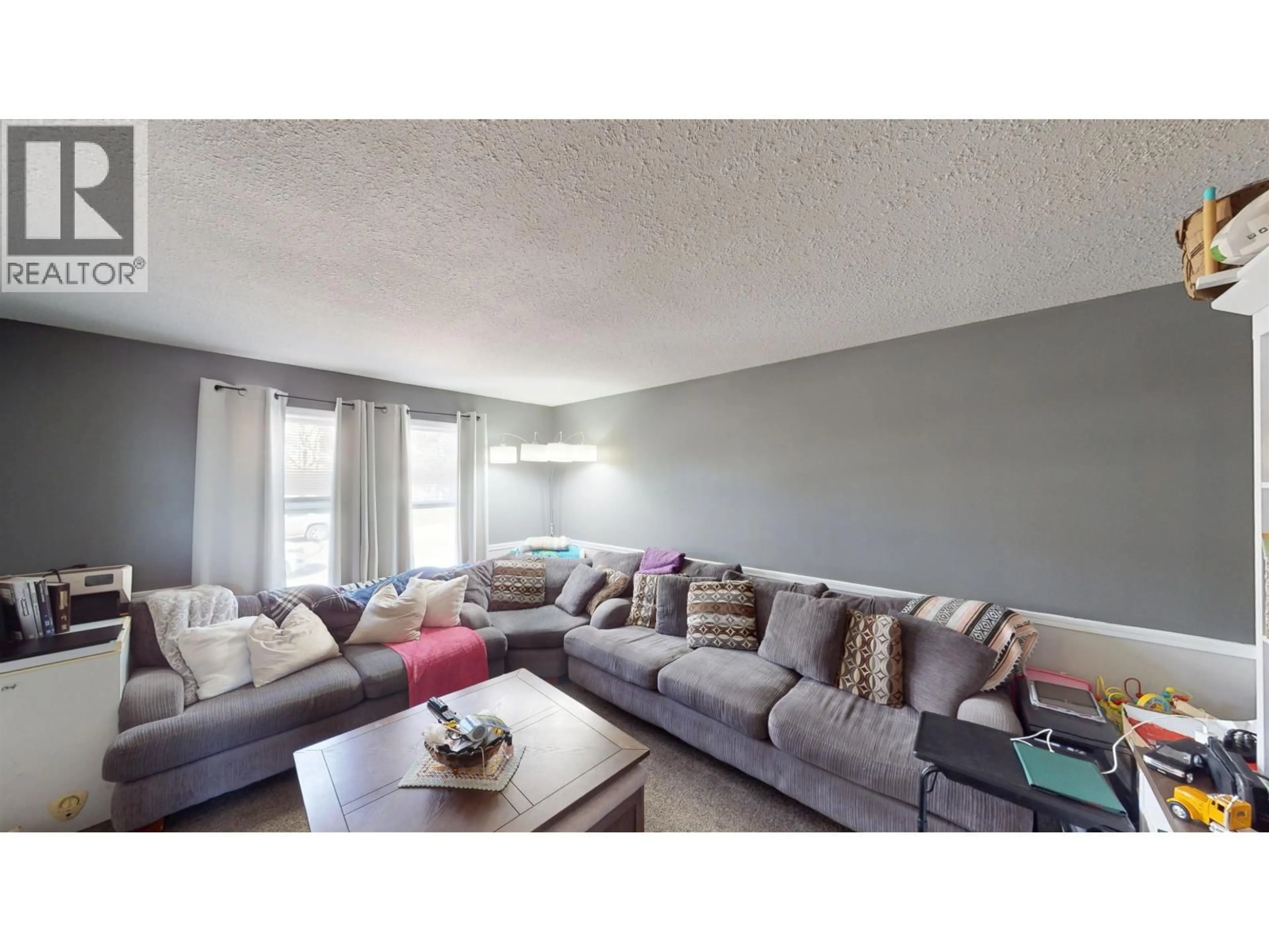 Living room with furniture, unknown for 10219 102 AVENUE, Fort St. John British Columbia V1J2E4