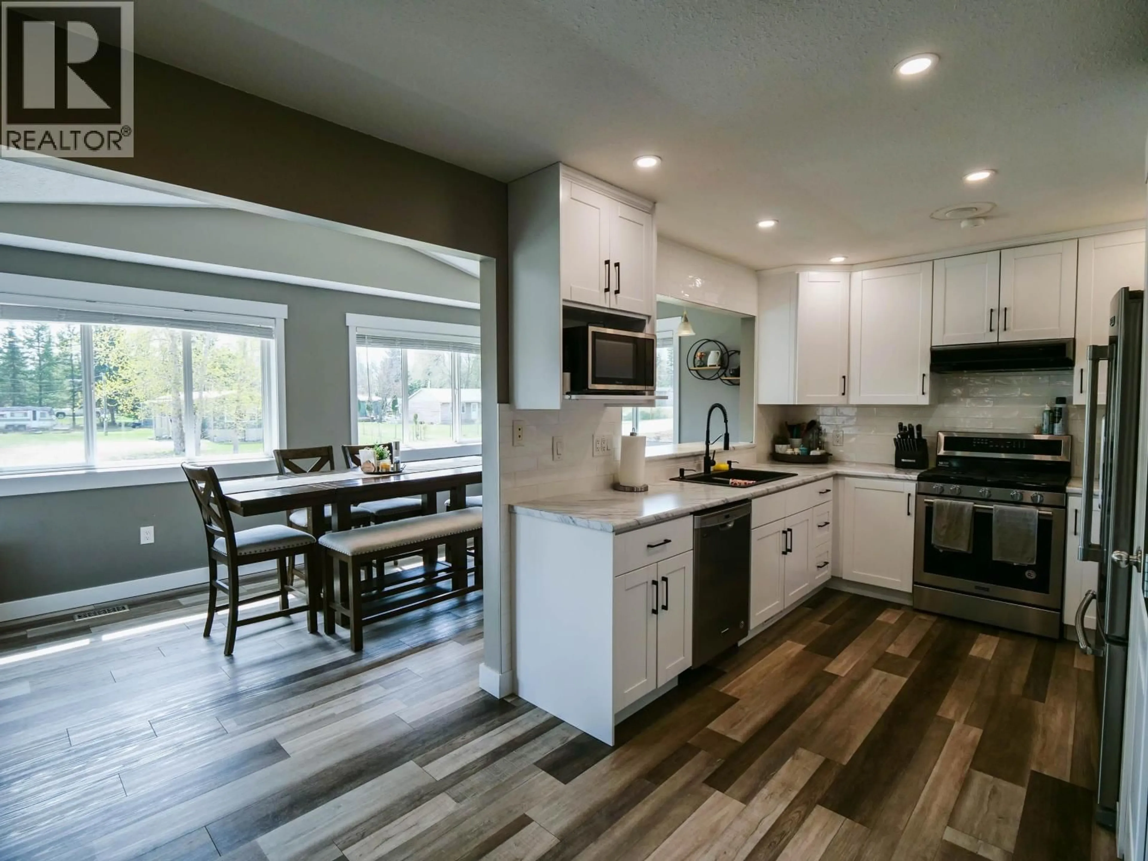 Open concept kitchen, wood/laminate floor for 1986 BALSAM AVENUE, Red Bluff / Dragon Lake British Columbia V2J3Y9