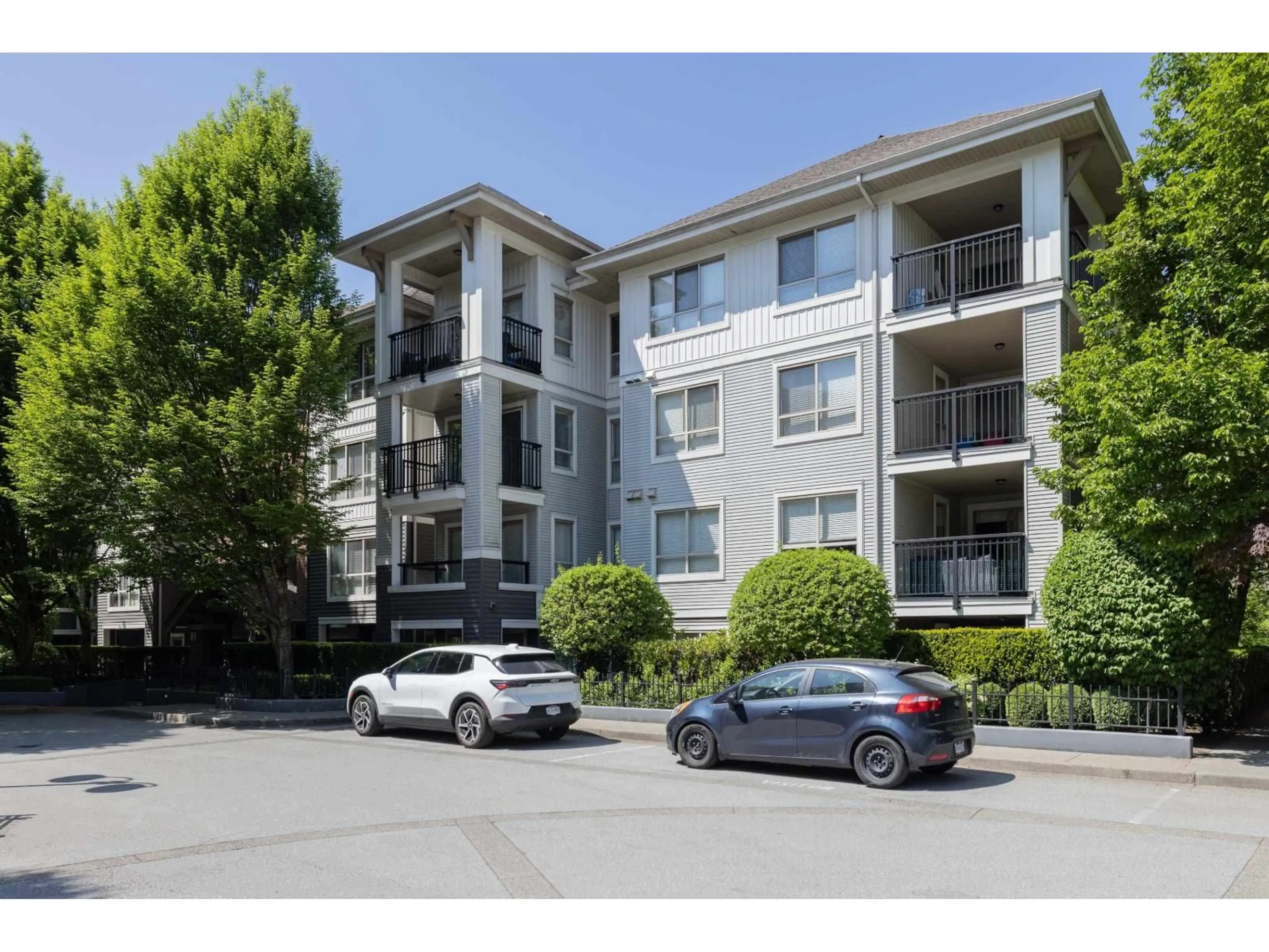A pic from outside/outdoor area/front of a property/back of a property/a pic from drone, street for D401 - 8929 202 STREET, Langley British Columbia V1M0B4