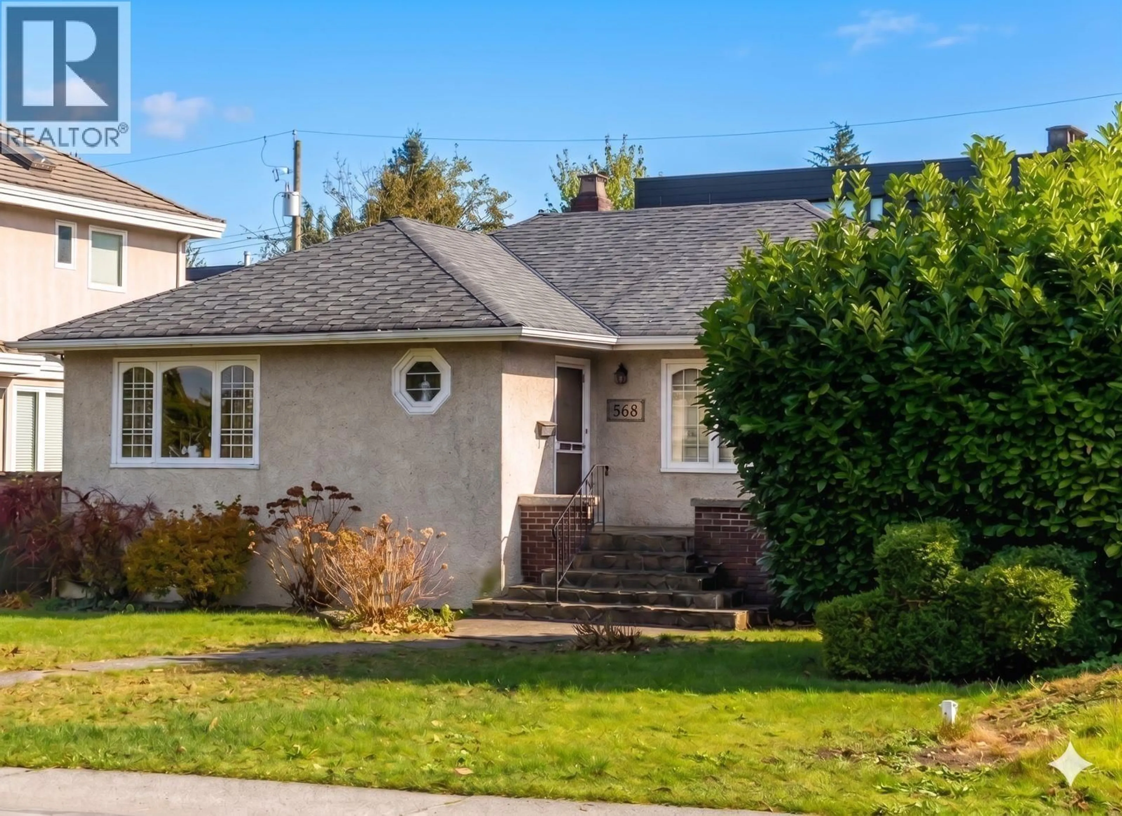 Home with vinyl exterior material, street for 568 KING EDWARD AVENUE, Vancouver British Columbia V5Z2C3