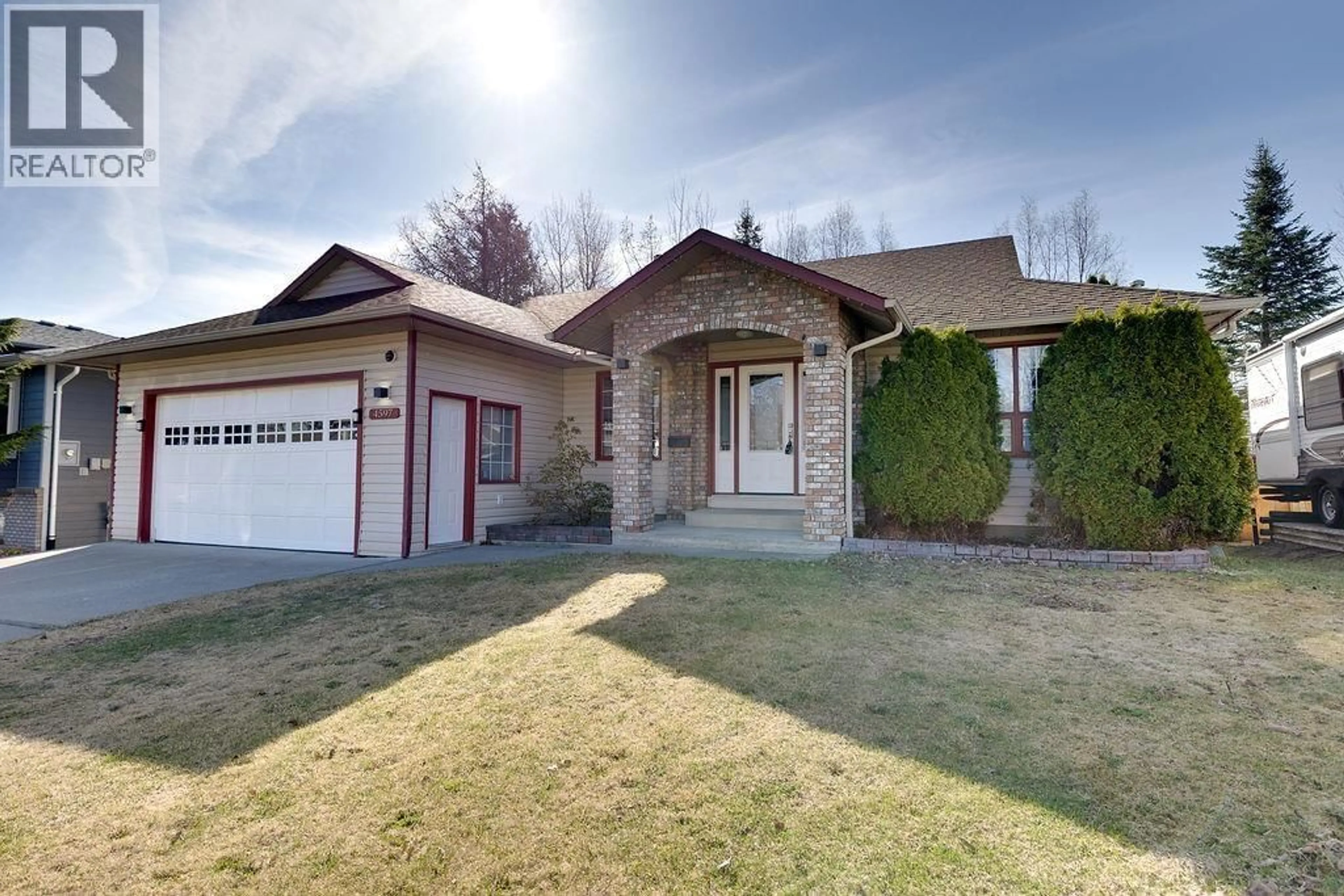 Home with brick exterior material, street for 4597 RAINER CRESCENT, Prince George British Columbia V2K4X1