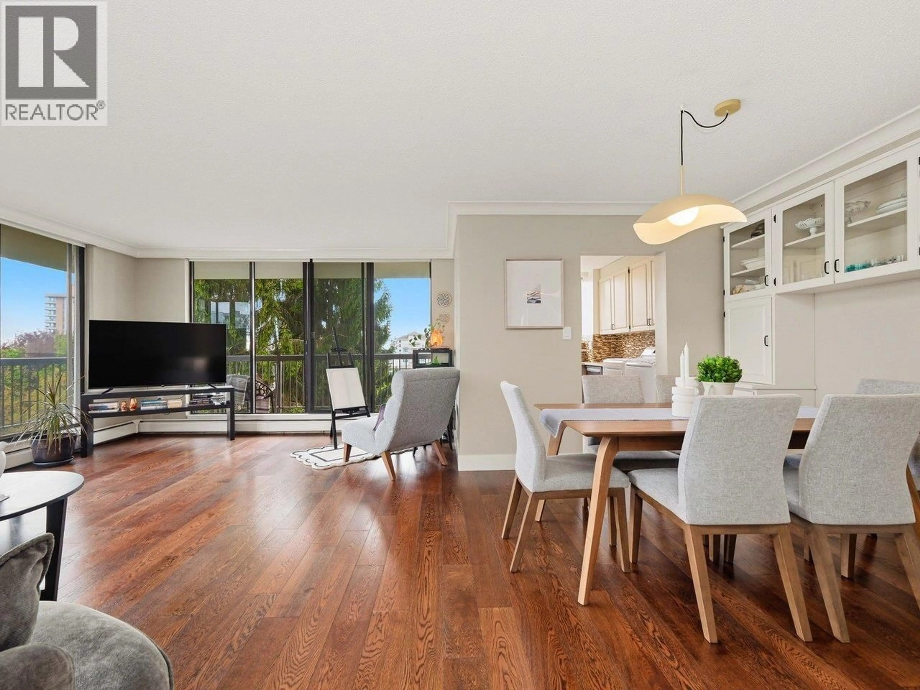 Living room with furniture, wood/laminate floor for 704 - 114 KEITH ROAD, North Vancouver British Columbia V7M3C9