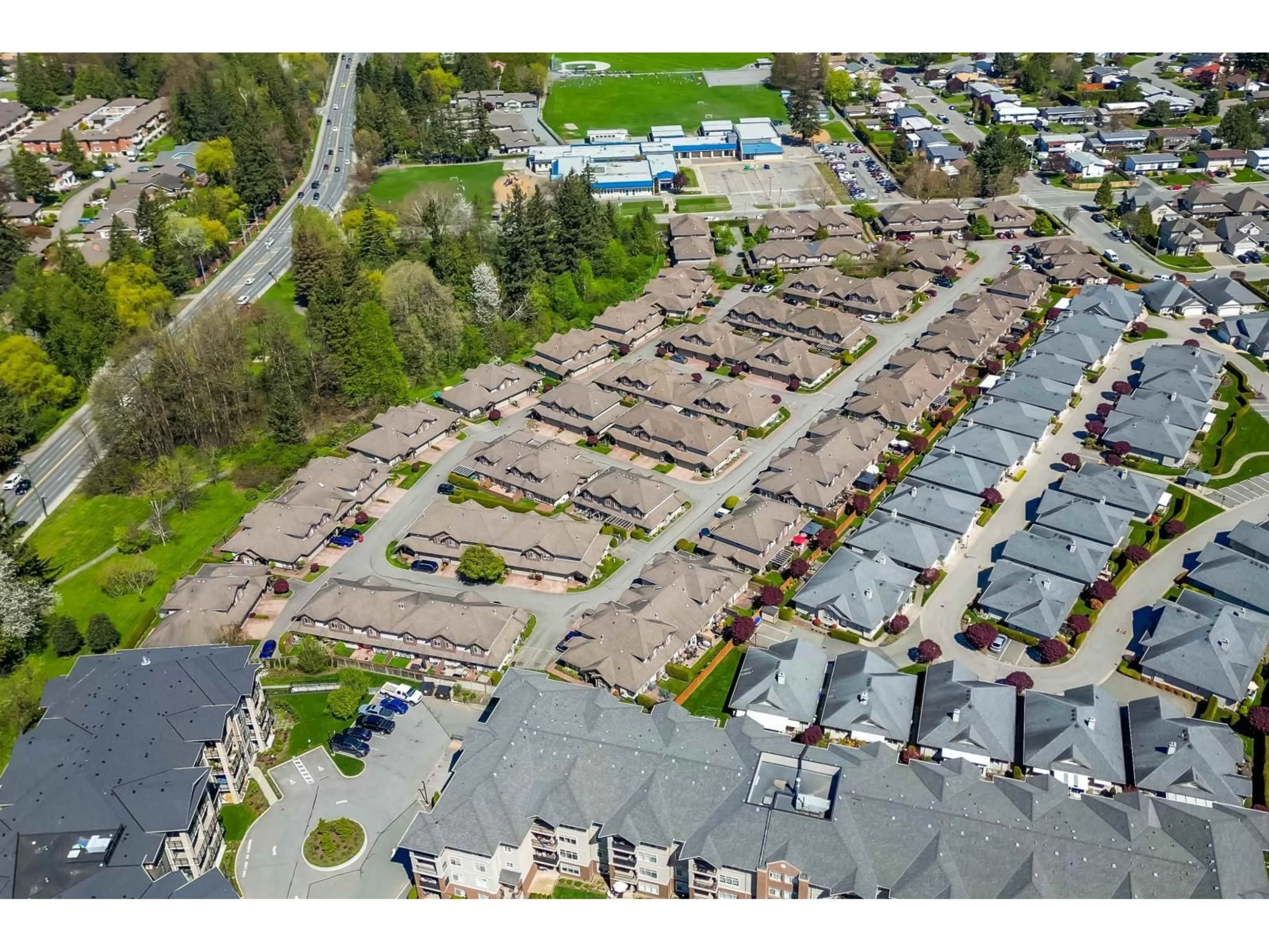 A pic from outside/outdoor area/front of a property/back of a property/a pic from drone, street for 70 - 6887 SHEFFIELD WAY, Sardis British Columbia V2R5V5