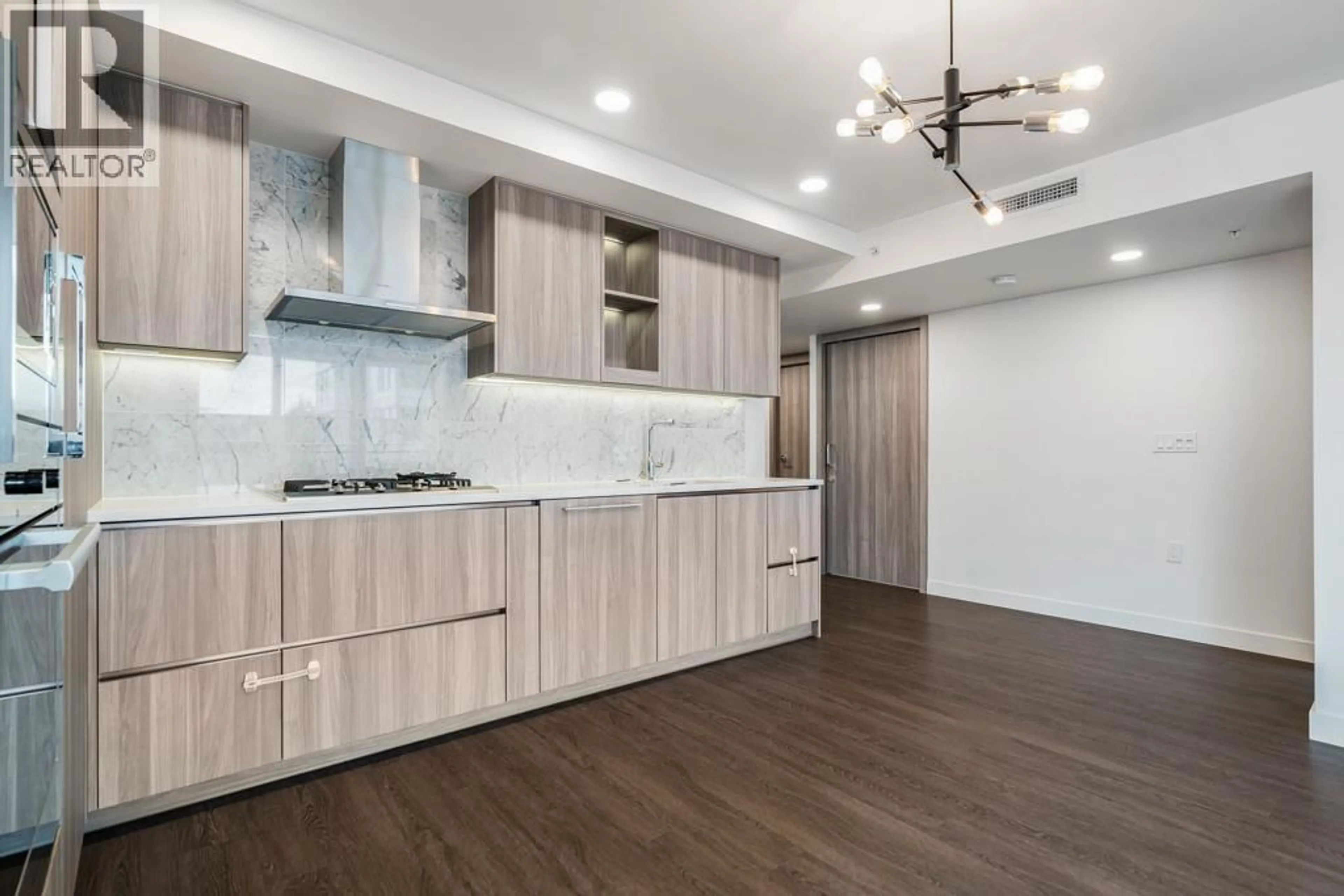 Open concept kitchen, wood/laminate floor for 712 - 455 MARINE DRIVE, Vancouver British Columbia V5X0H3