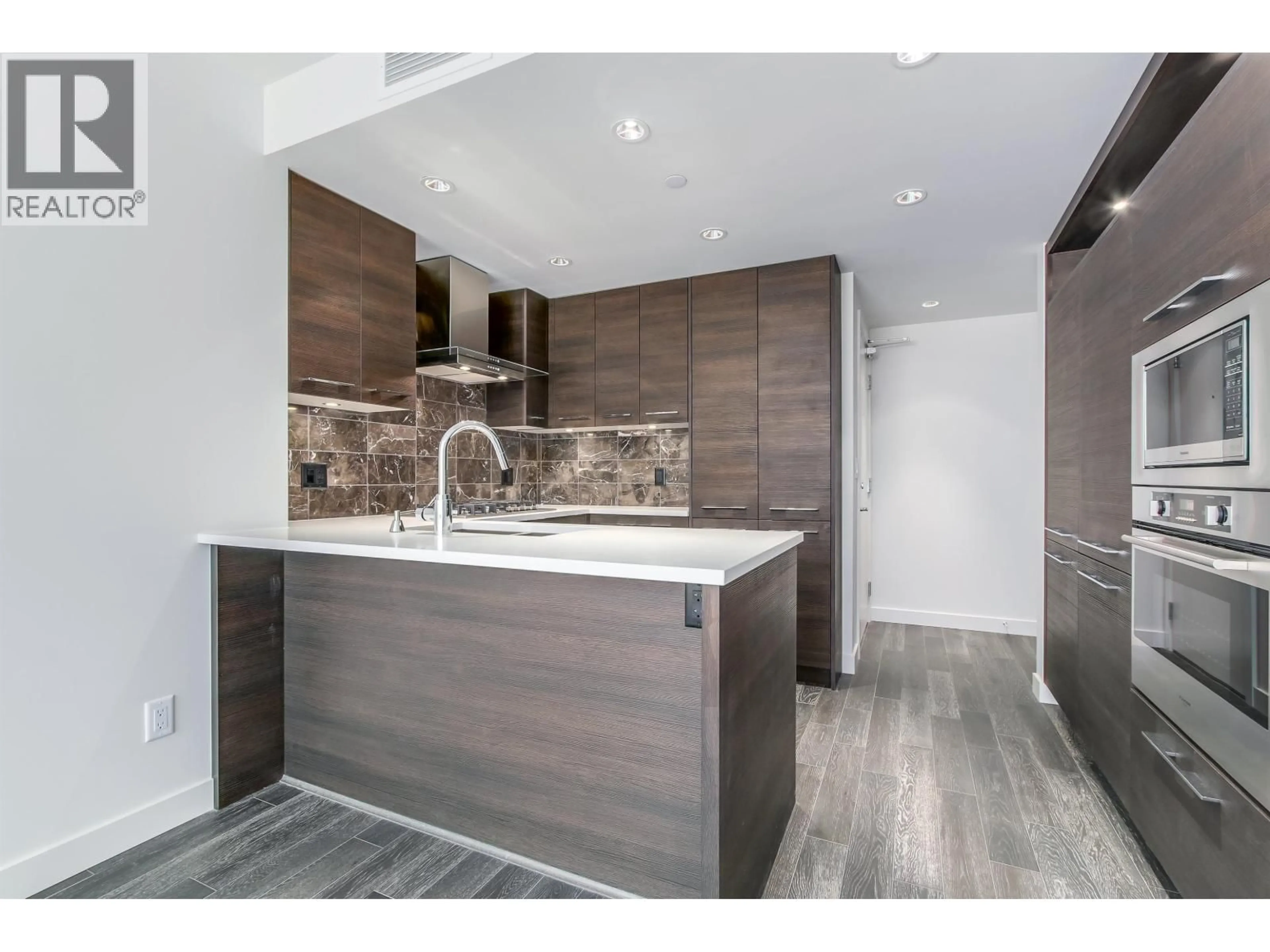 Open concept kitchen, wood/laminate floor for 601 - 7468 LANSDOWNE ROAD, Richmond British Columbia V7C0B7