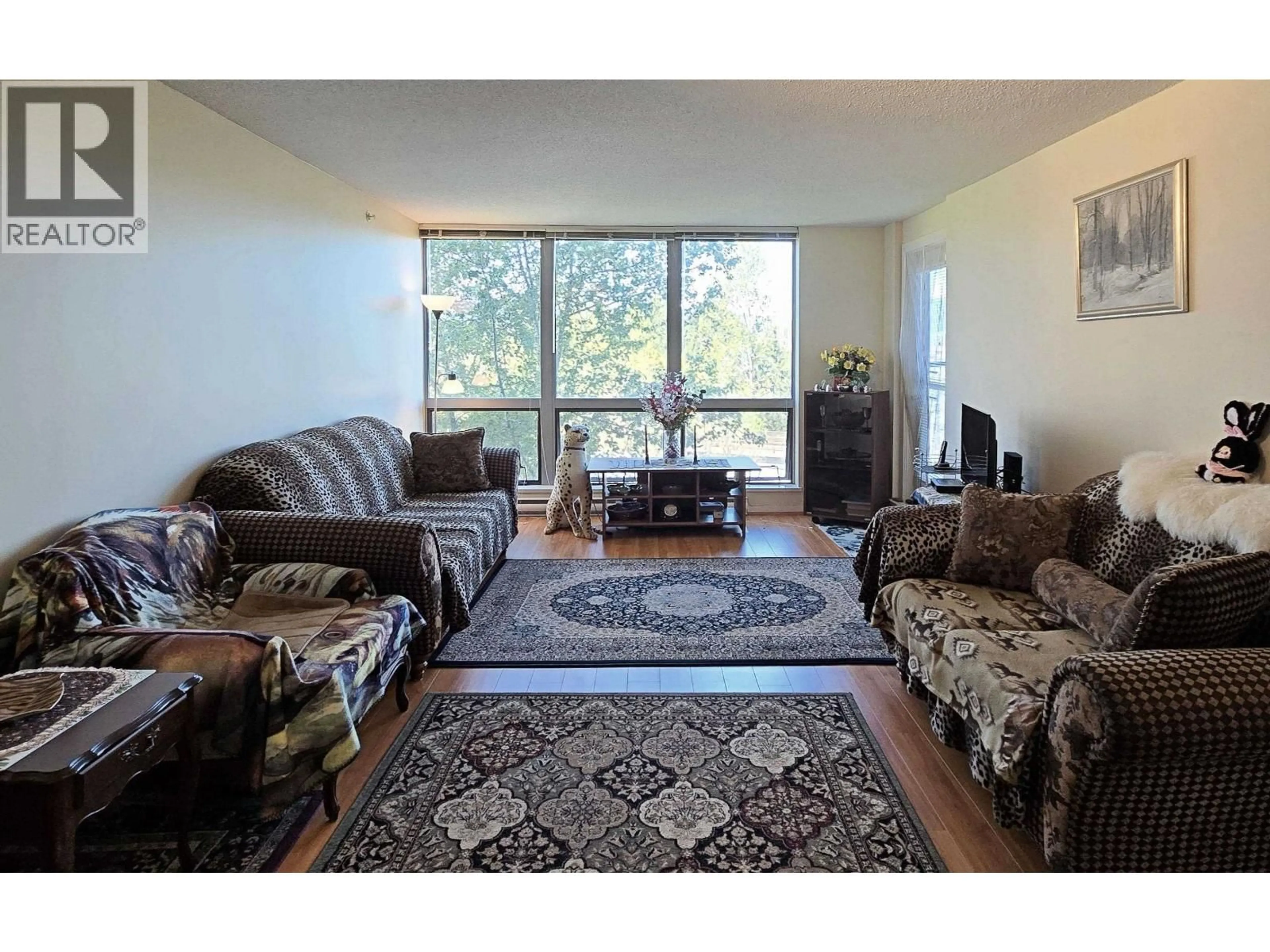 Living room with furniture, unknown for 810 - 3663 CROWLEY DRIVE, Vancouver British Columbia V5R6H4