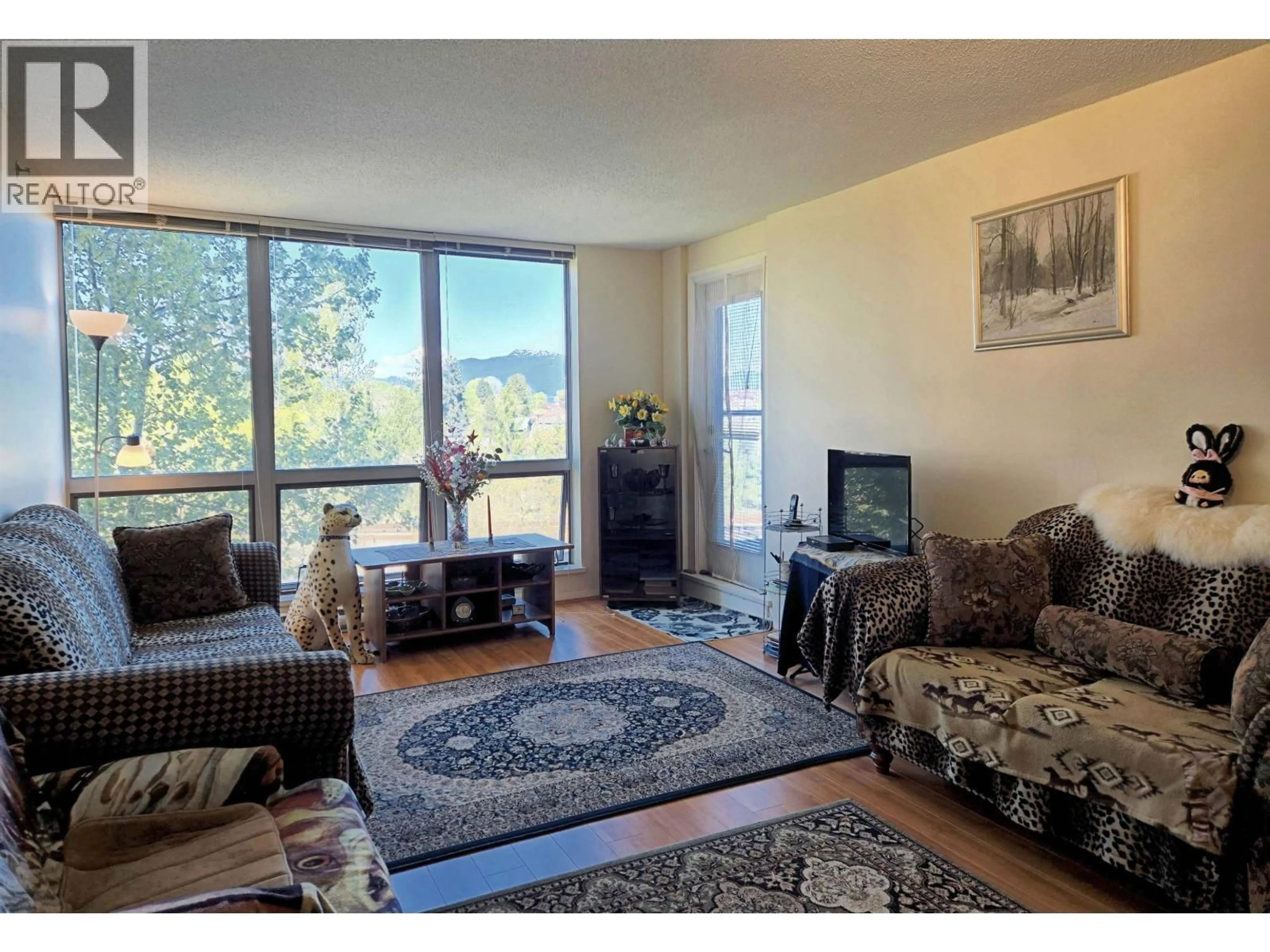 Living room with furniture, unknown for 810 - 3663 CROWLEY DRIVE, Vancouver British Columbia V5R6H4