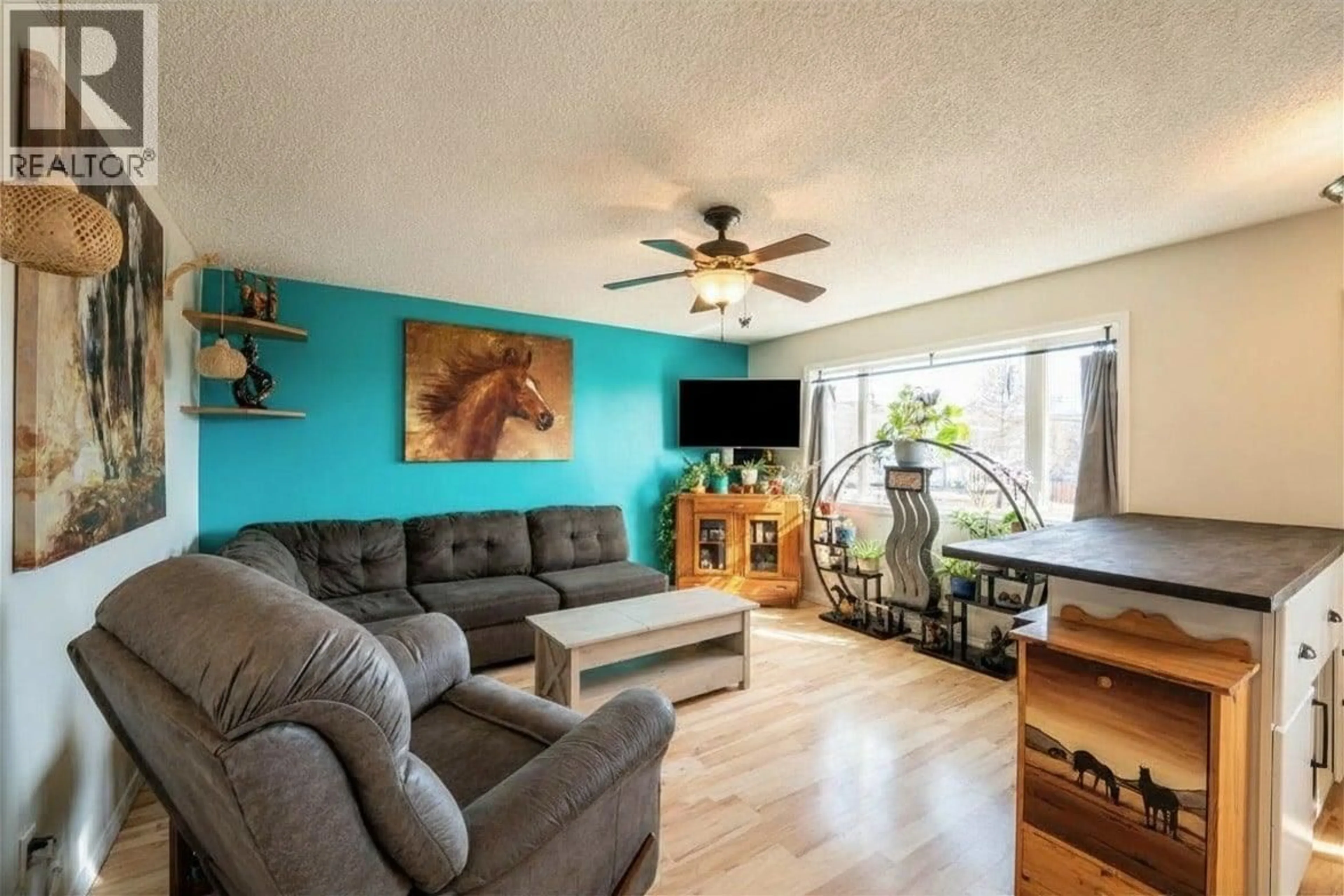 Living room with furniture, wood/laminate floor for 9672 N SPRUCE STREET, Taylor British Columbia V0C2K0