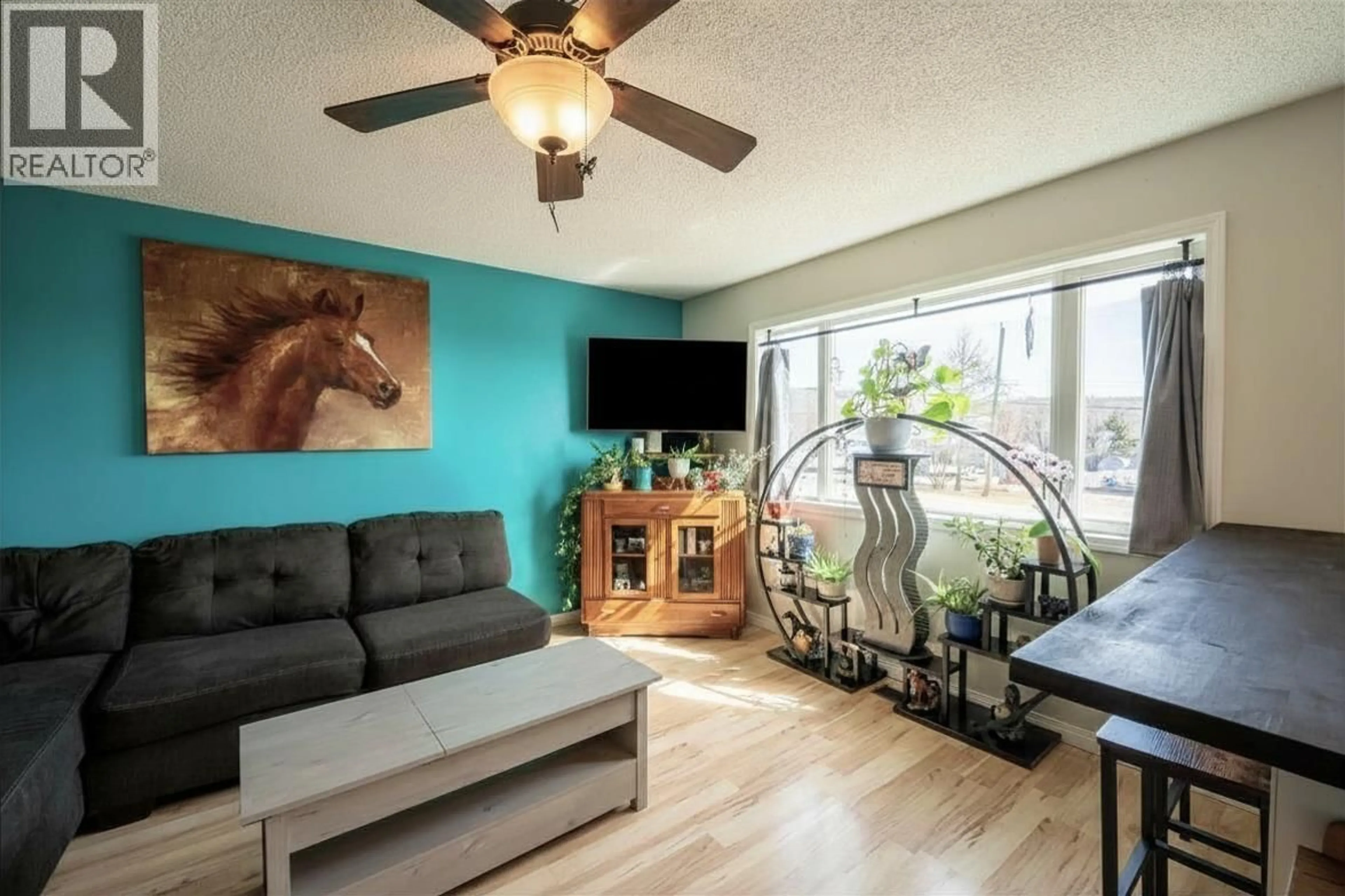 Living room with furniture, wood/laminate floor for 9672 N SPRUCE STREET, Taylor British Columbia V0C2K0