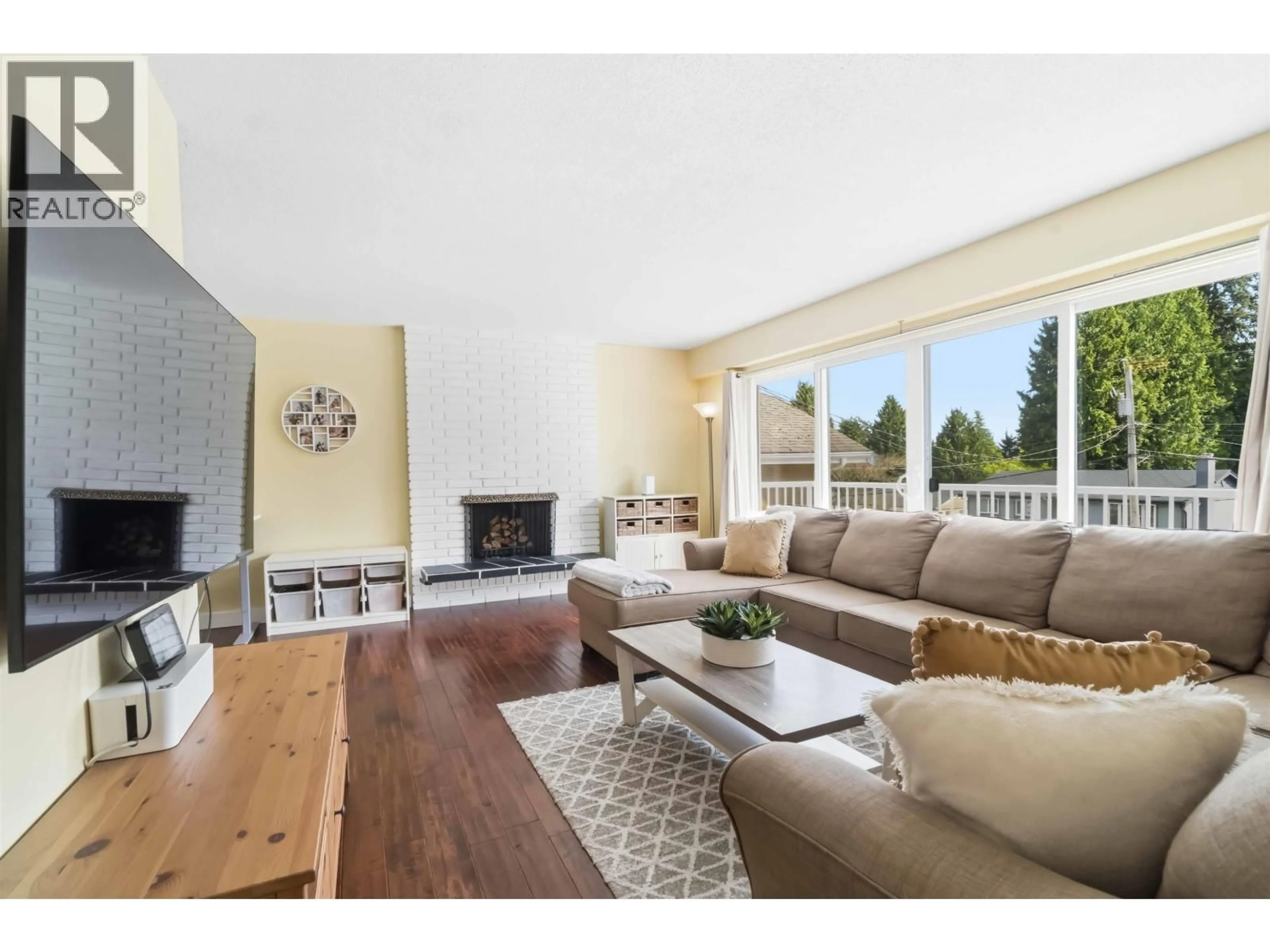 Living room with furniture, wood/laminate floor for 1861 CHALMERS AVENUE, Port Coquitlam British Columbia V3B2T3