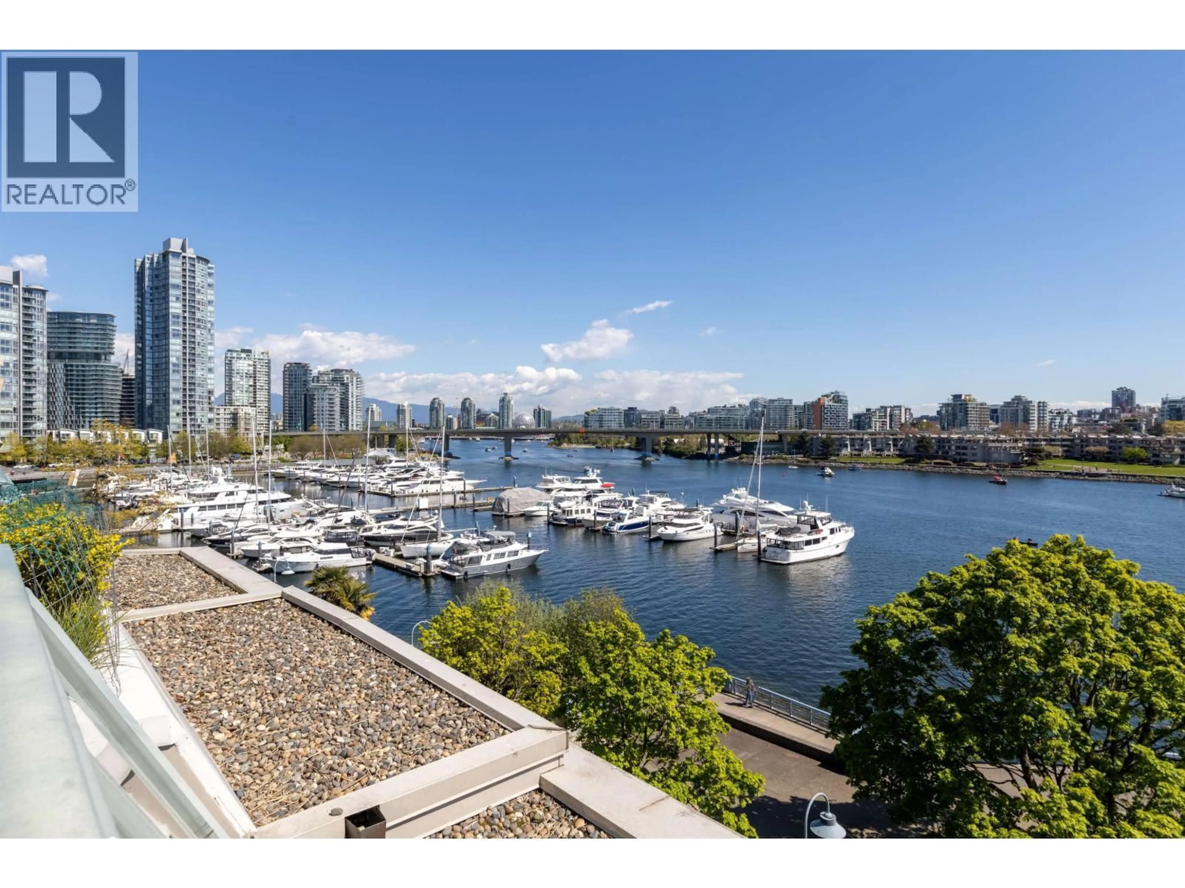 A pic from outside/outdoor area/front of a property/back of a property/a pic from drone, water/lake/river/ocean view for 606 - 1288 MARINASIDE CRESCENT, Vancouver British Columbia V6Z2W5