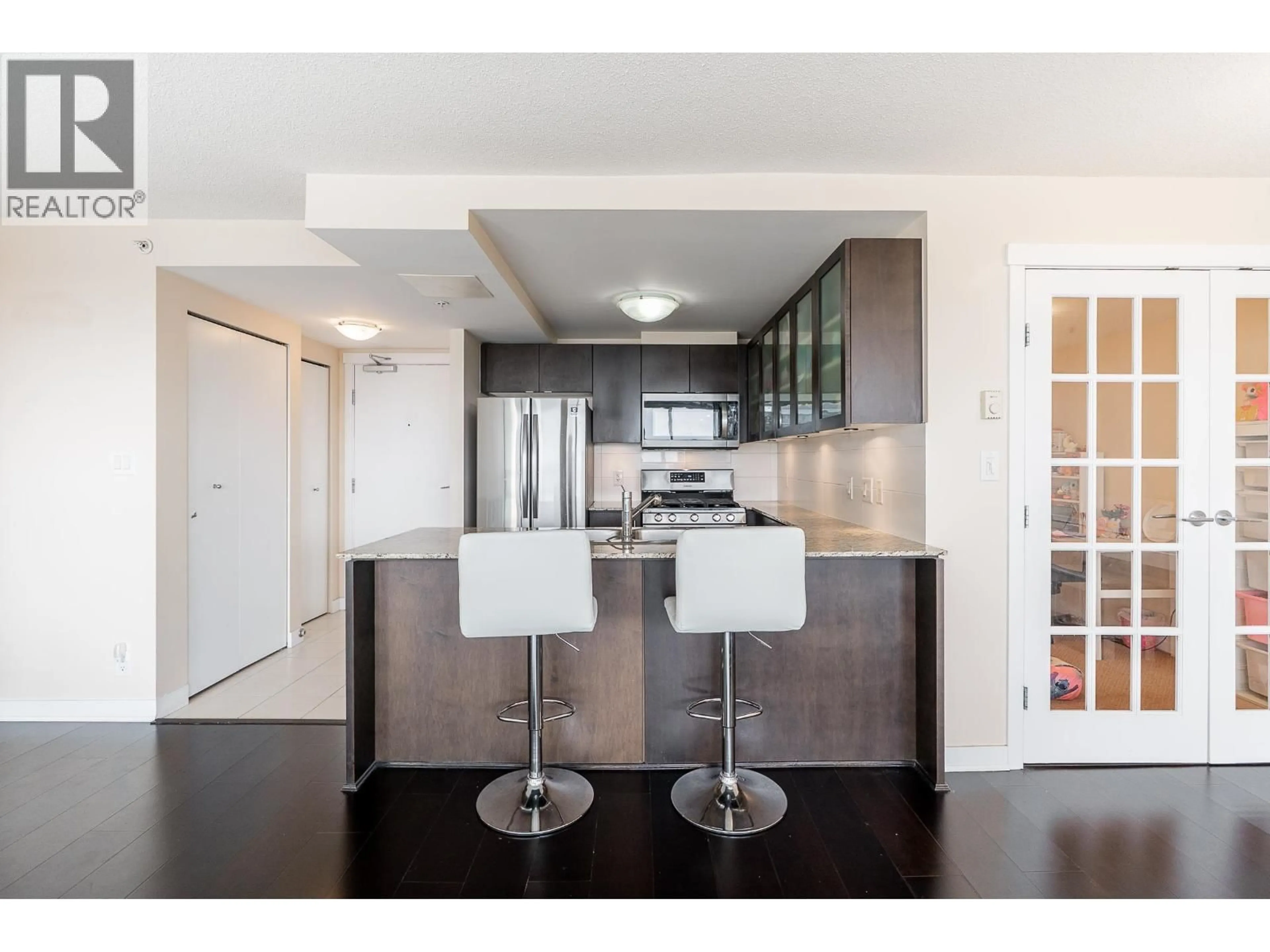 Open concept kitchen, wood/laminate floor for 1602 - 7555 ALDERBRIDGE WAY, Richmond British Columbia V6X4L3
