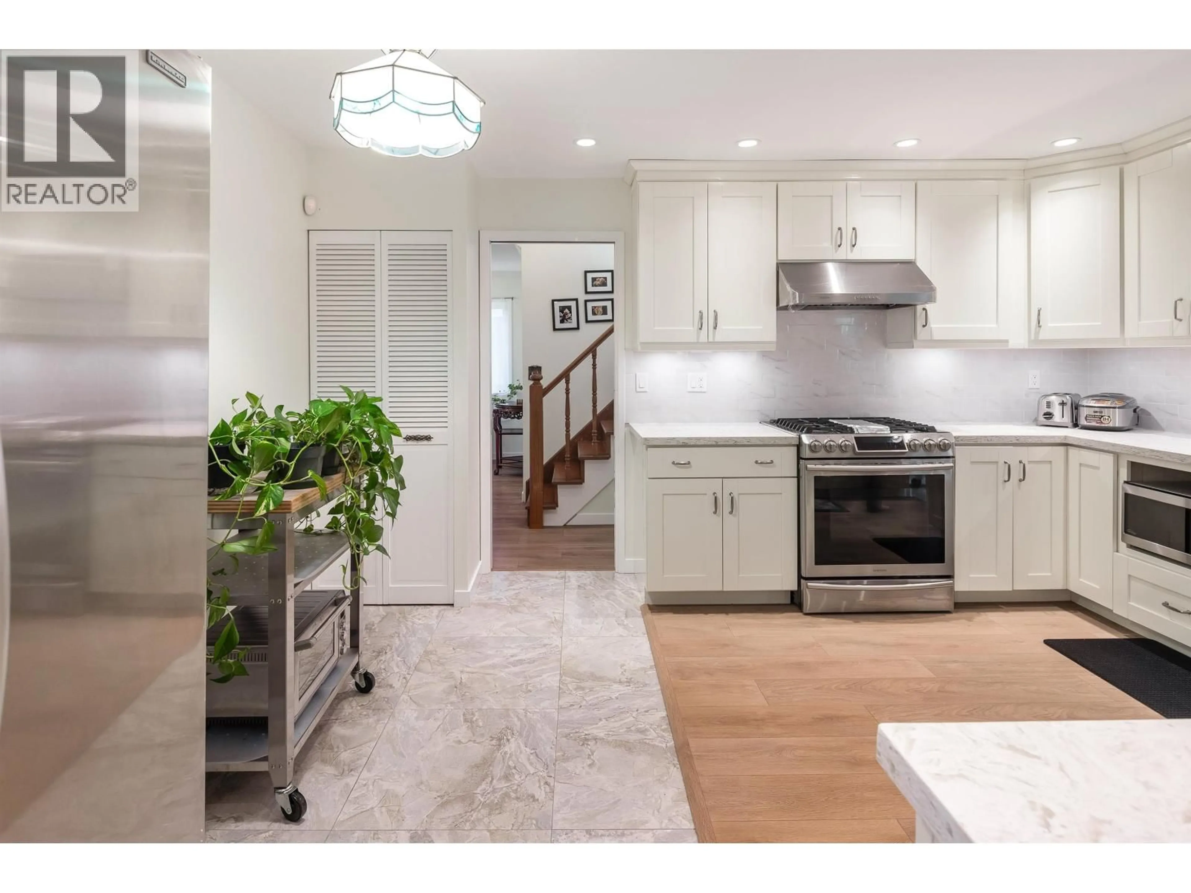 Open concept kitchen, ceramic/tile floor for 7720 NO. 1 ROAD, Richmond British Columbia V7C1T6