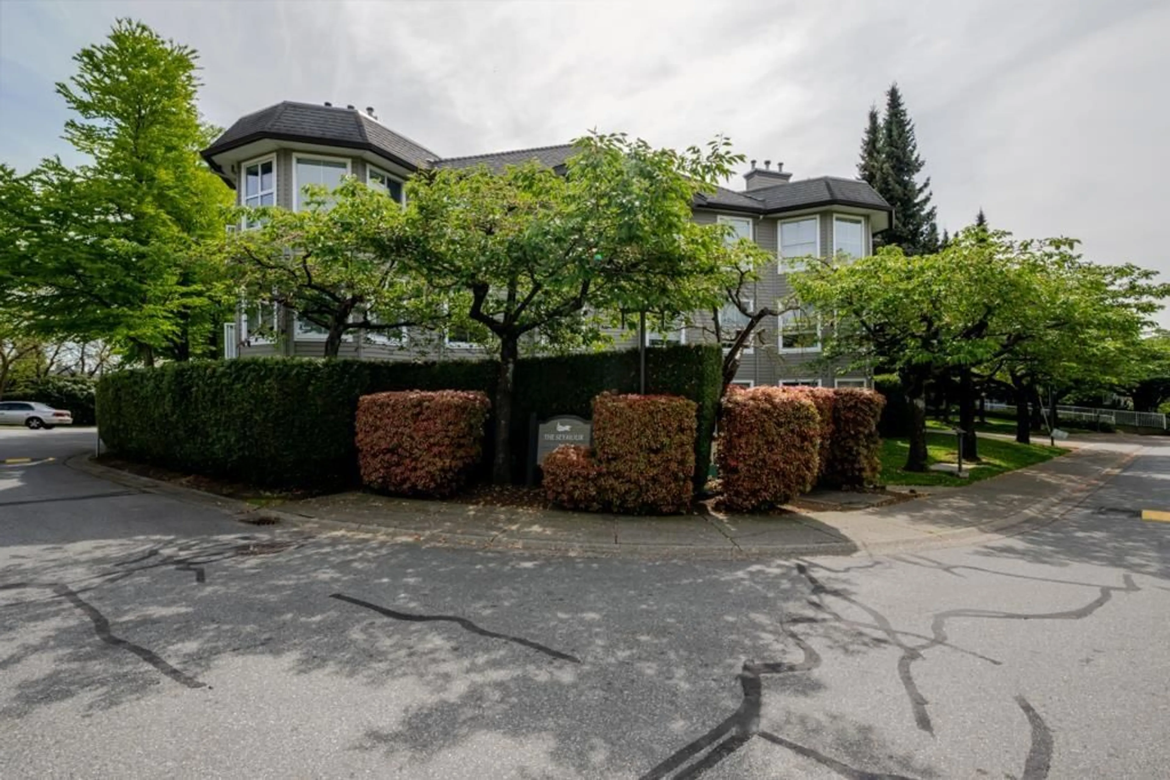 A pic from outside/outdoor area/front of a property/back of a property/a pic from drone, street for 201 - 15150 108 AVENUE, Surrey British Columbia V3R0V1