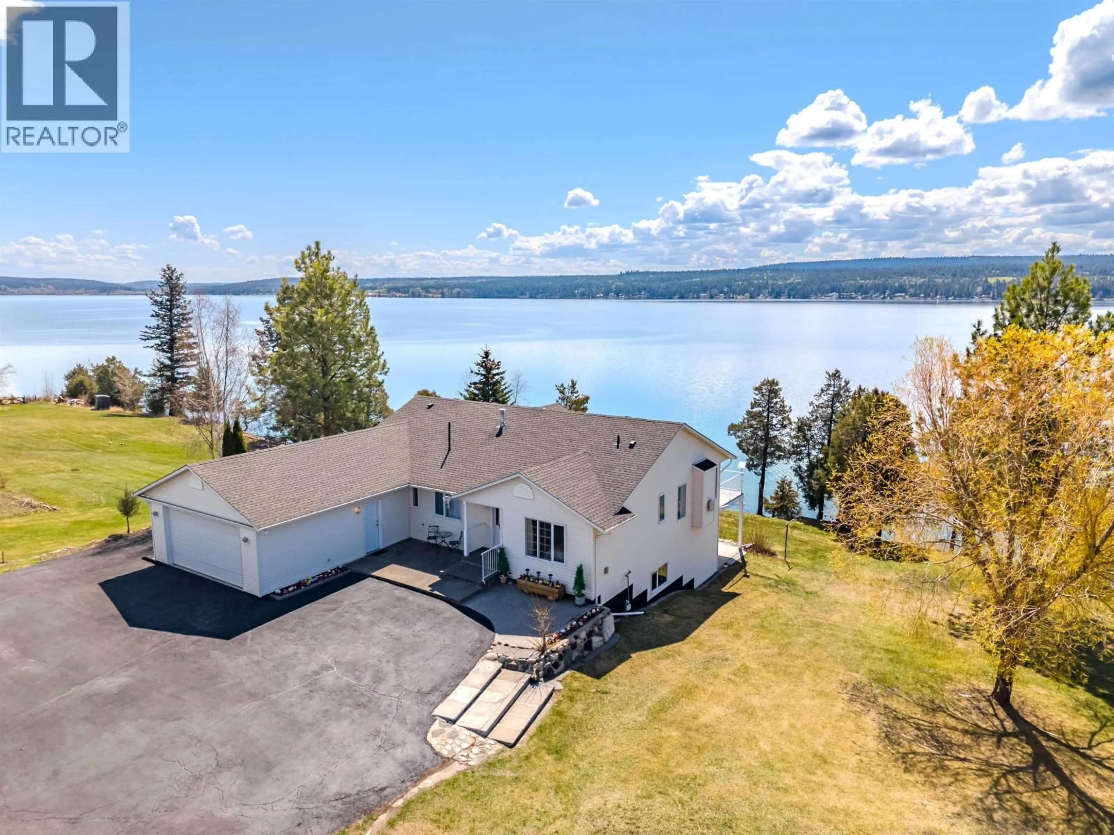 A pic from outside/outdoor area/front of a property/back of a property/a pic from drone, water/lake/river/ocean view for 3895 LAKE CREST ROAD, Lac La Hache British Columbia V0K1T0