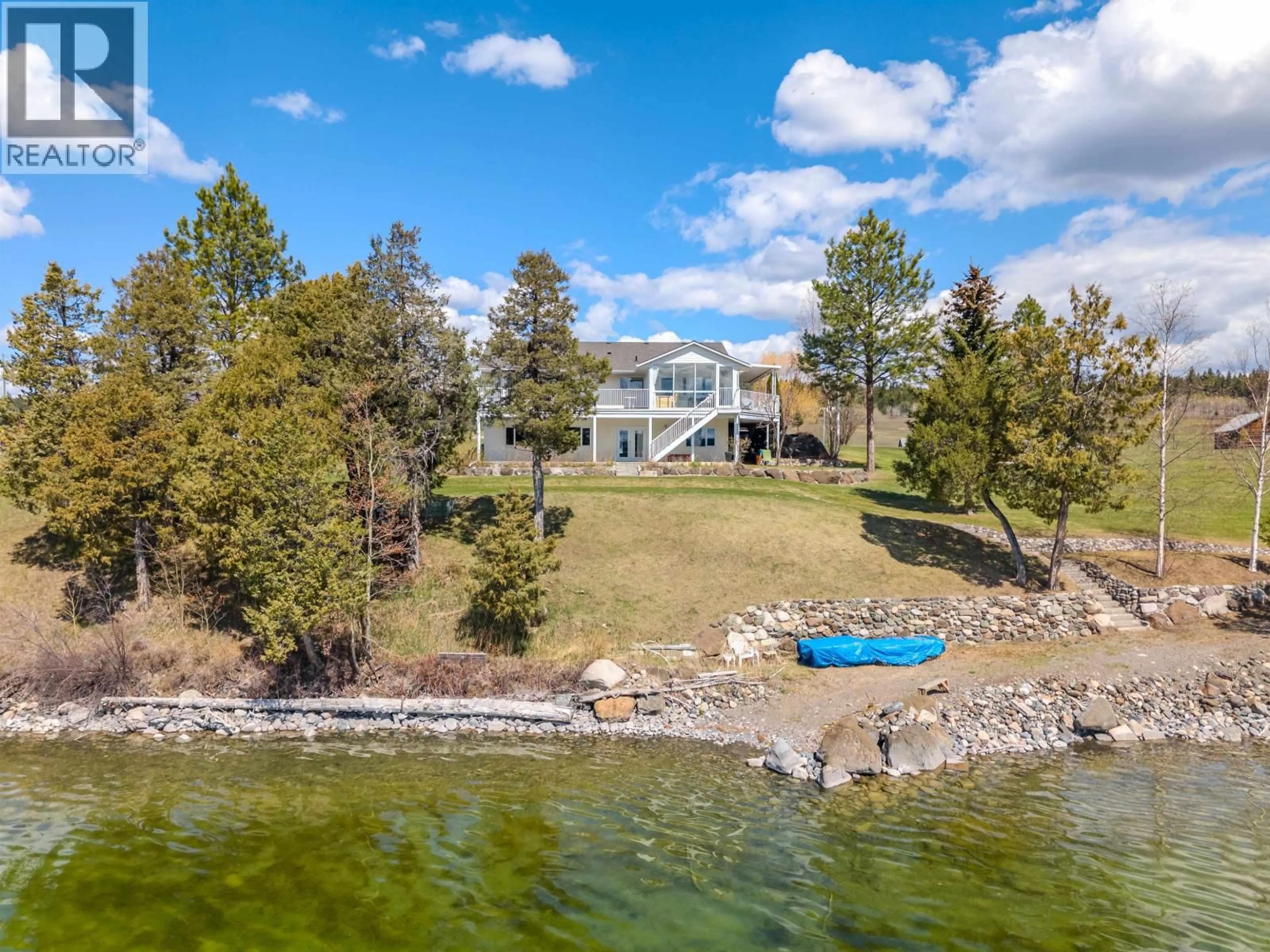 A pic from outside/outdoor area/front of a property/back of a property/a pic from drone, water/lake/river/ocean view for 3895 LAKE CREST ROAD, Lac La Hache British Columbia V0K1T0