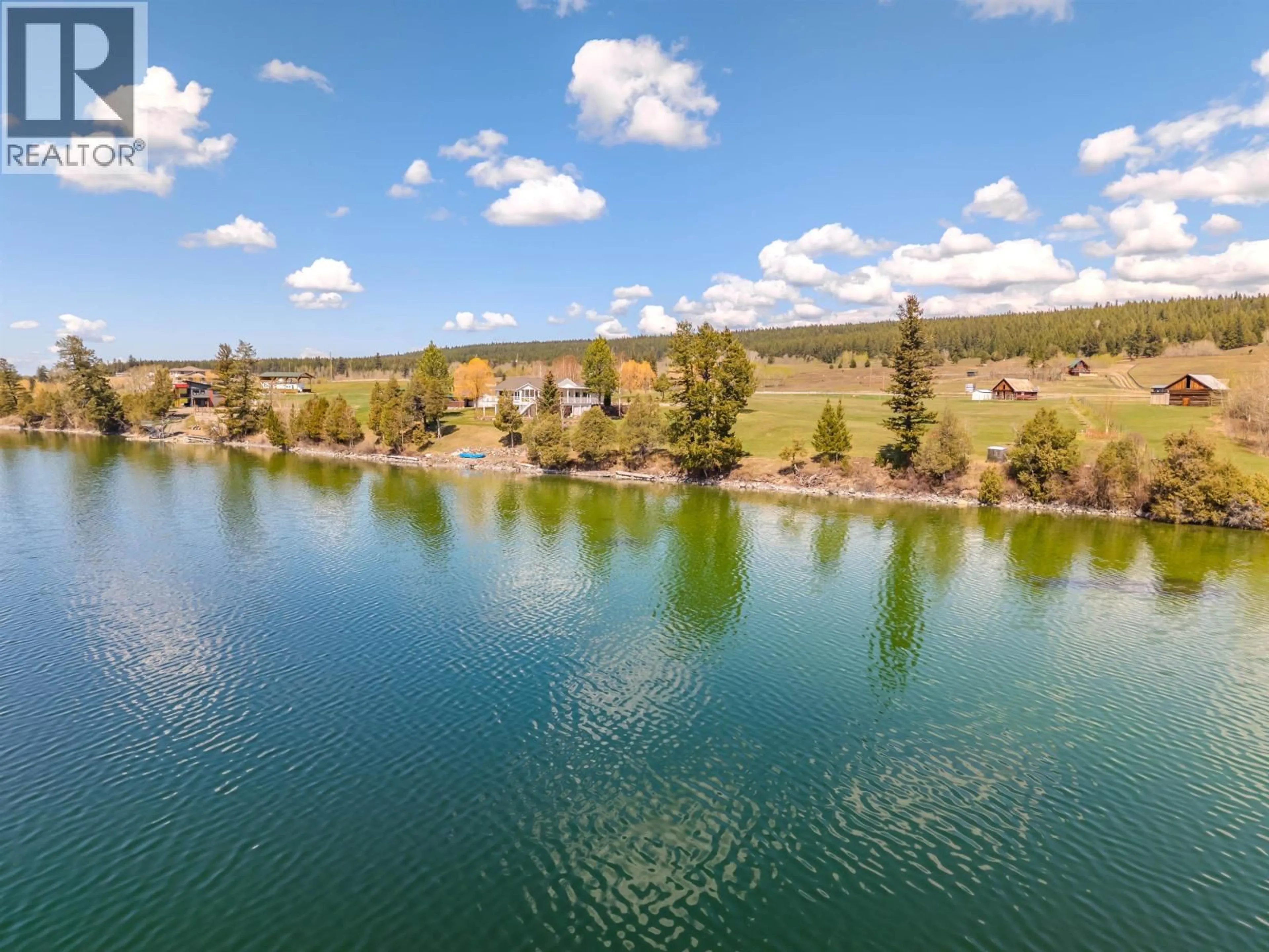 A pic from outside/outdoor area/front of a property/back of a property/a pic from drone, water/lake/river/ocean view for 3895 LAKE CREST ROAD, Lac La Hache British Columbia V0K1T0