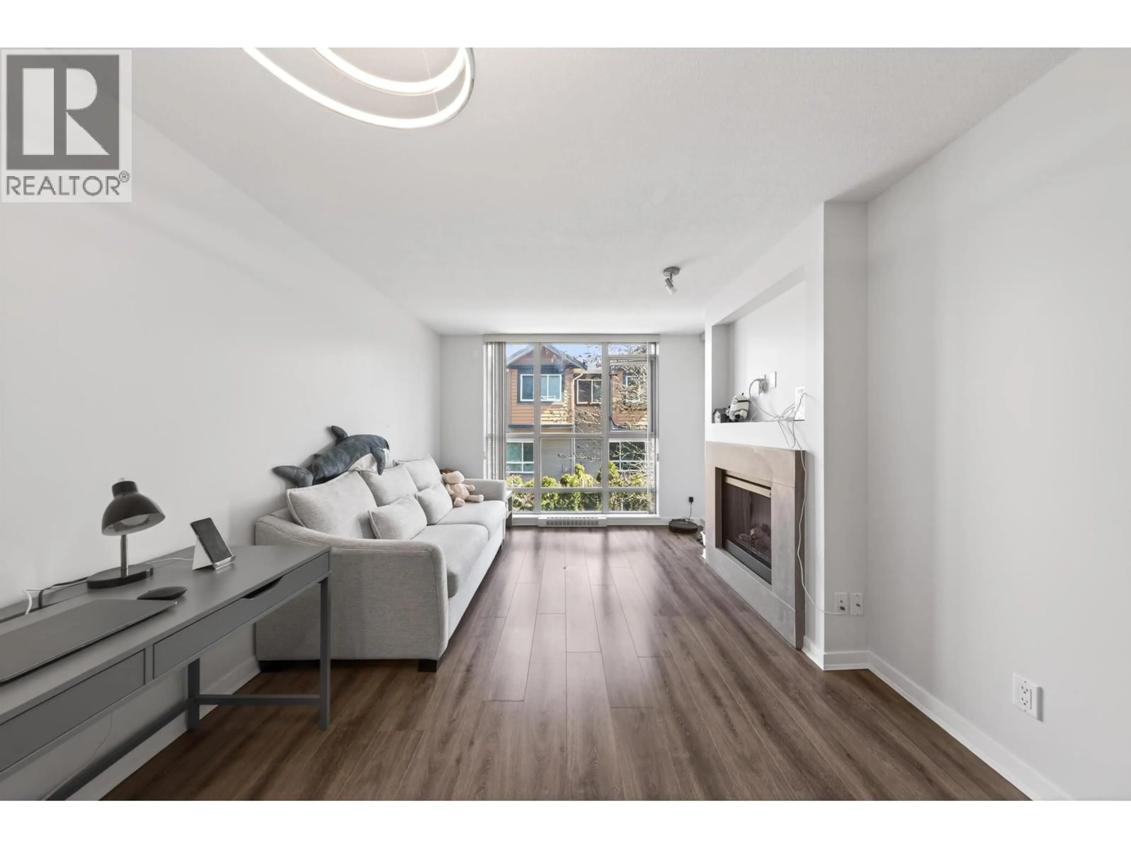 Living room with furniture, wood/laminate floor for 208 - 9373 HEMLOCK DRIVE, Richmond British Columbia V6Y0A9