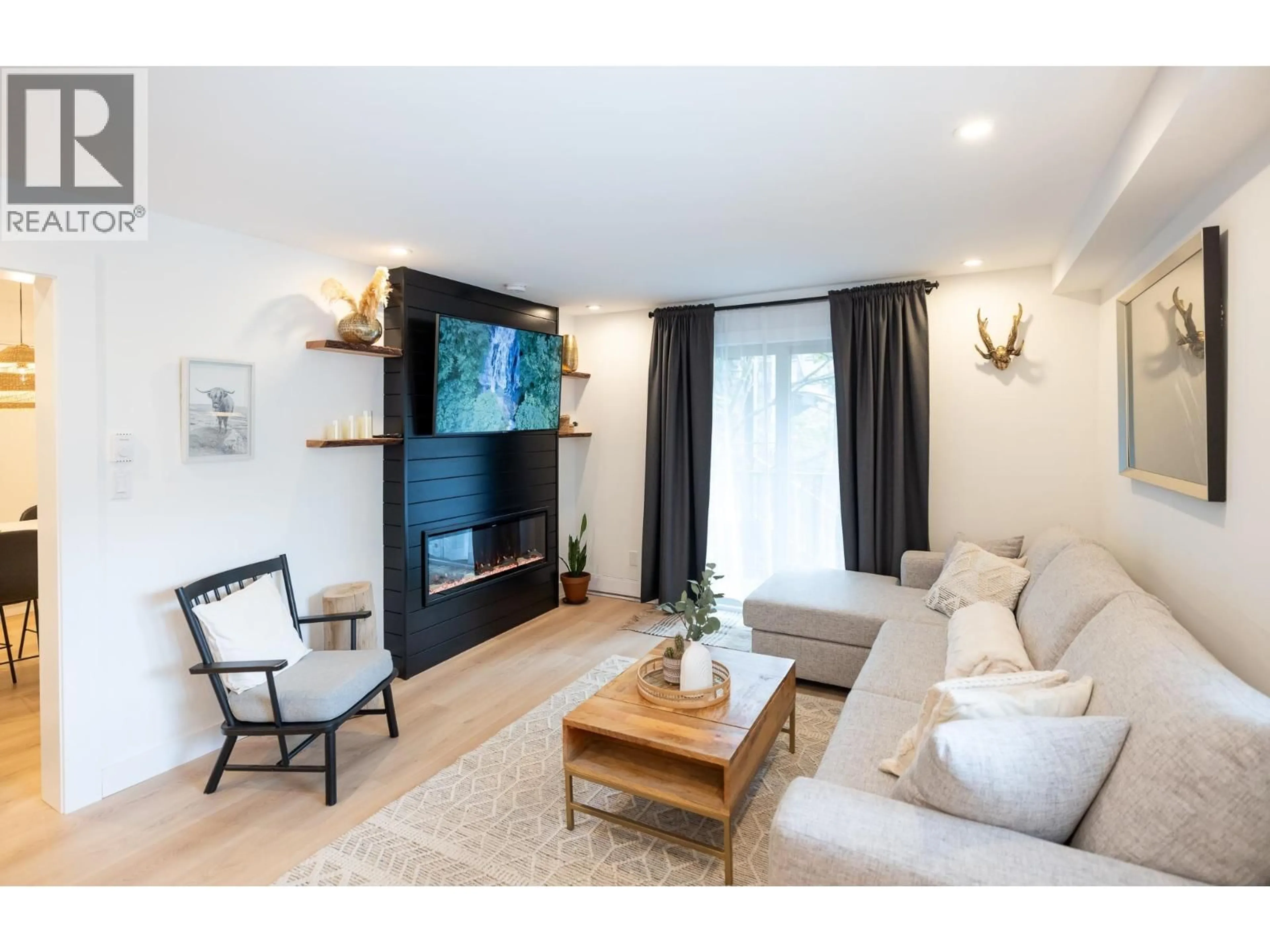 Living room with furniture, wood/laminate floor for 100 - 2021 KAREN CRESCENT, Whistler British Columbia V8E0H1