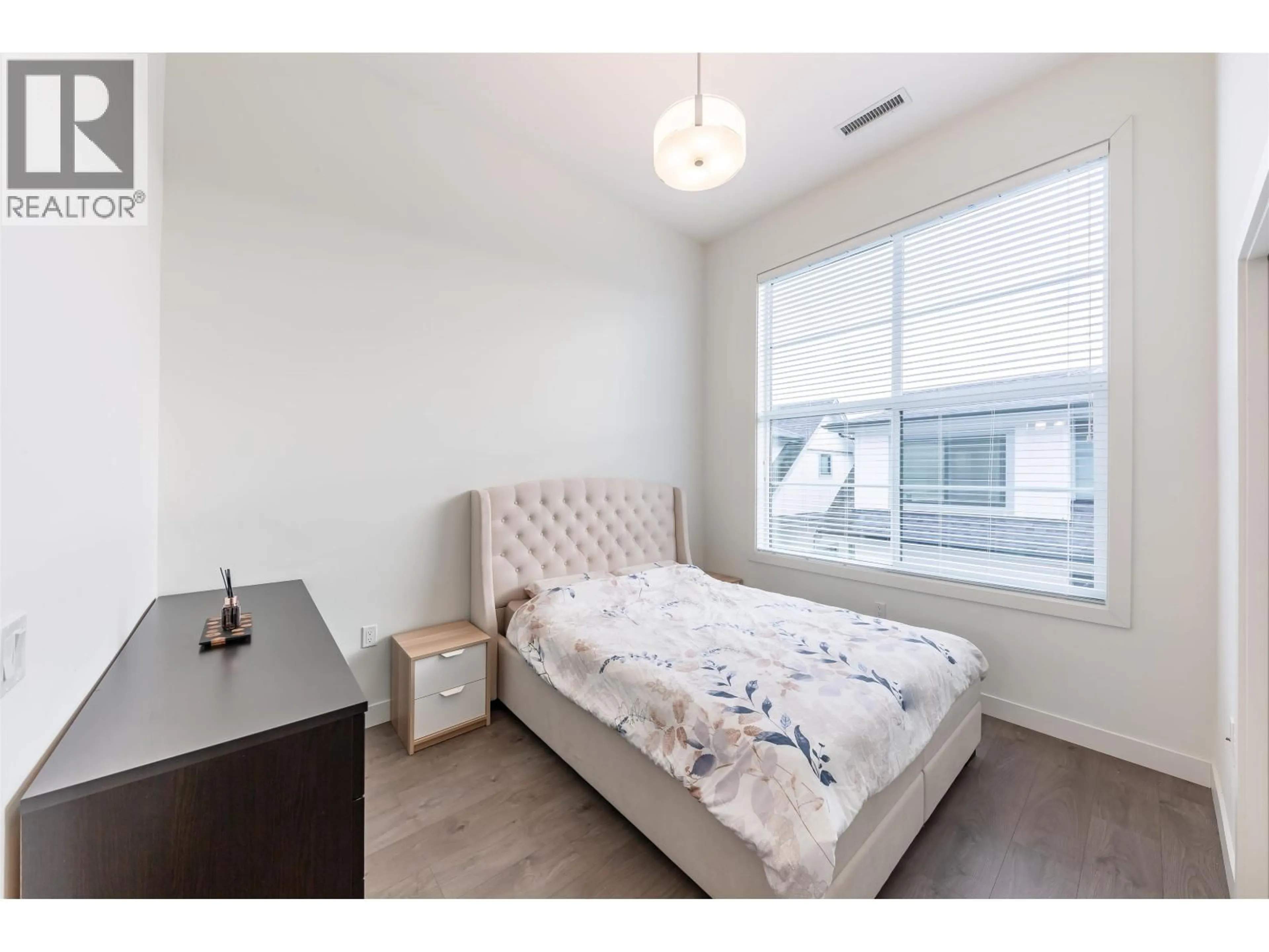 Bedroom with bed, wood/laminate floor for 21 - 7168 LYNNWOOD DRIVE, Richmond British Columbia V7C0E3
