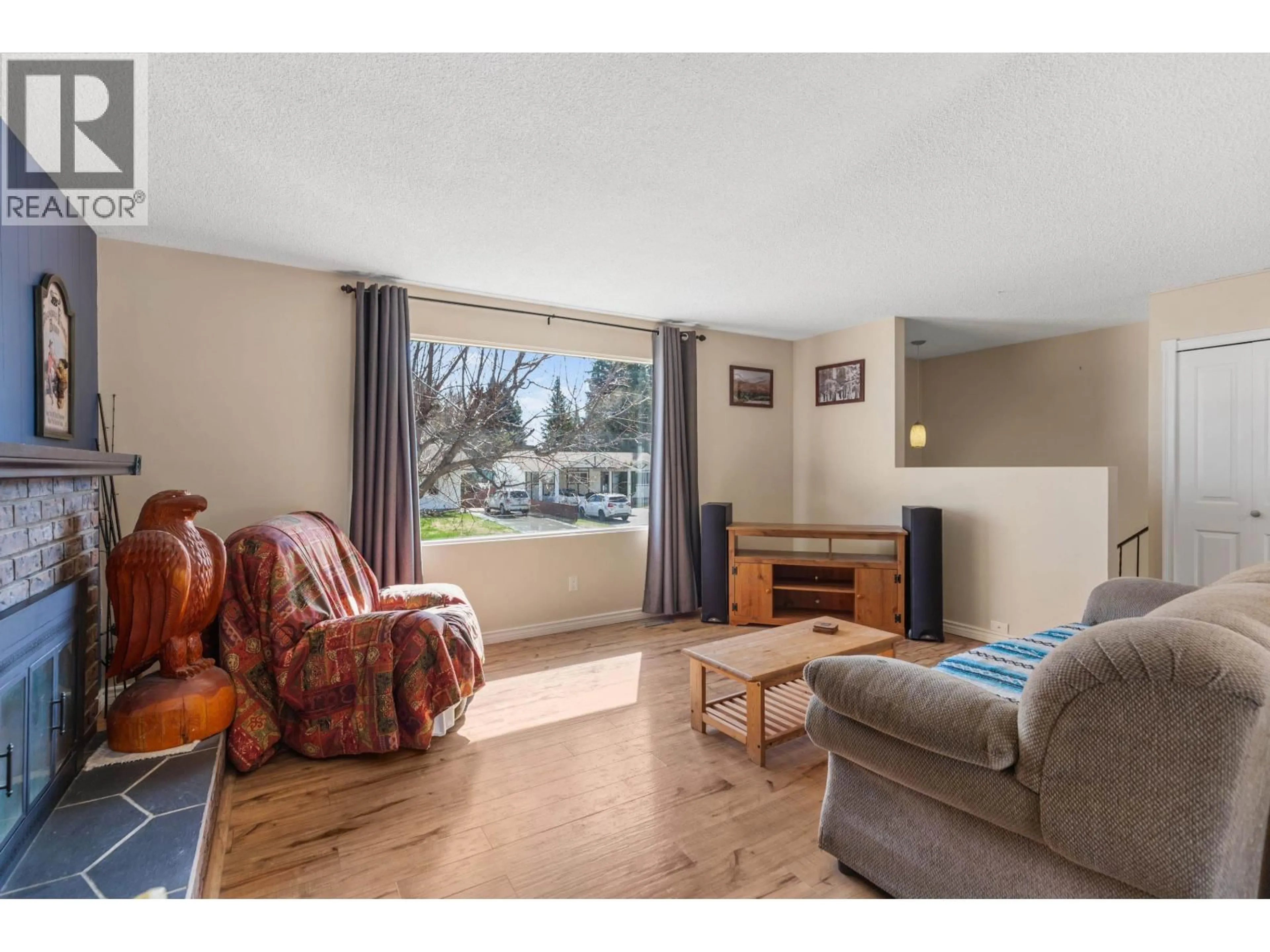 Living room with furniture, wood/laminate floor for 2327 OLDS STREET, Prince George British Columbia V2N3B8