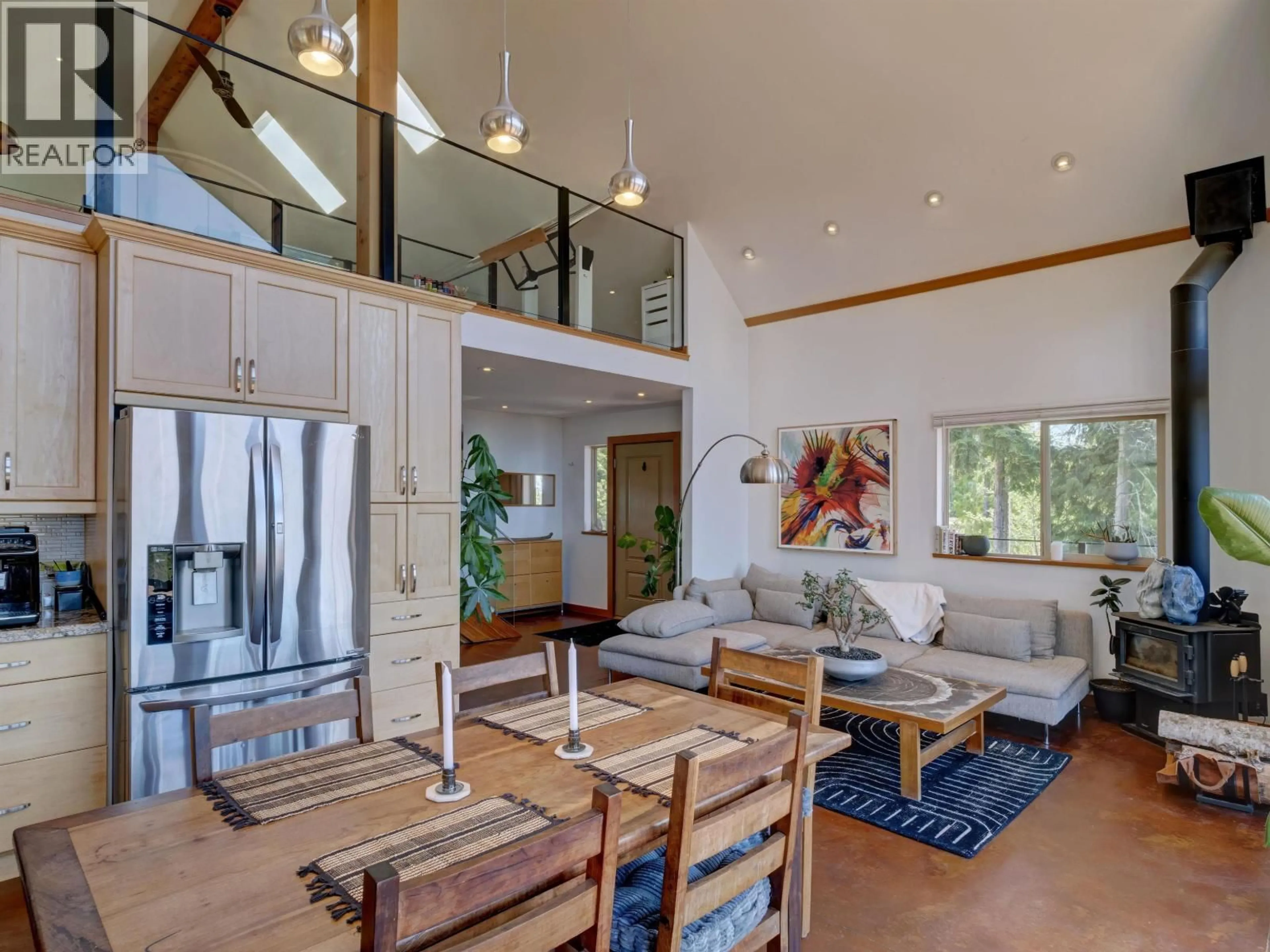 Open concept kitchen, wood/laminate floor for 9340 STEPHENS WAY, Halfmoon Bay British Columbia V7Z1G9
