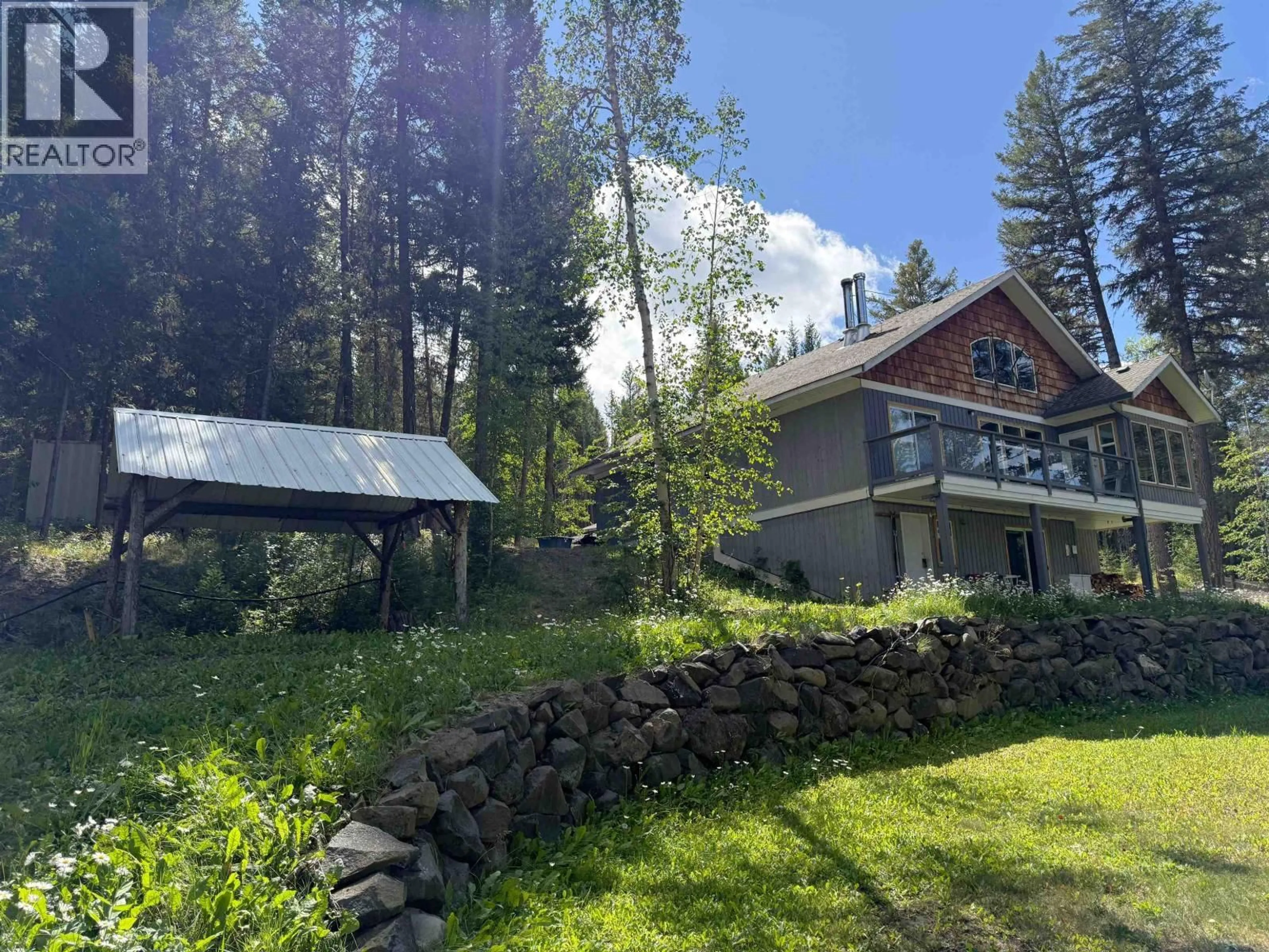 A pic from outside/outdoor area/front of a property/back of a property/a pic from drone, forest/trees view for 6513 MONETTE ROAD, 100 Mile House British Columbia V0K1K0