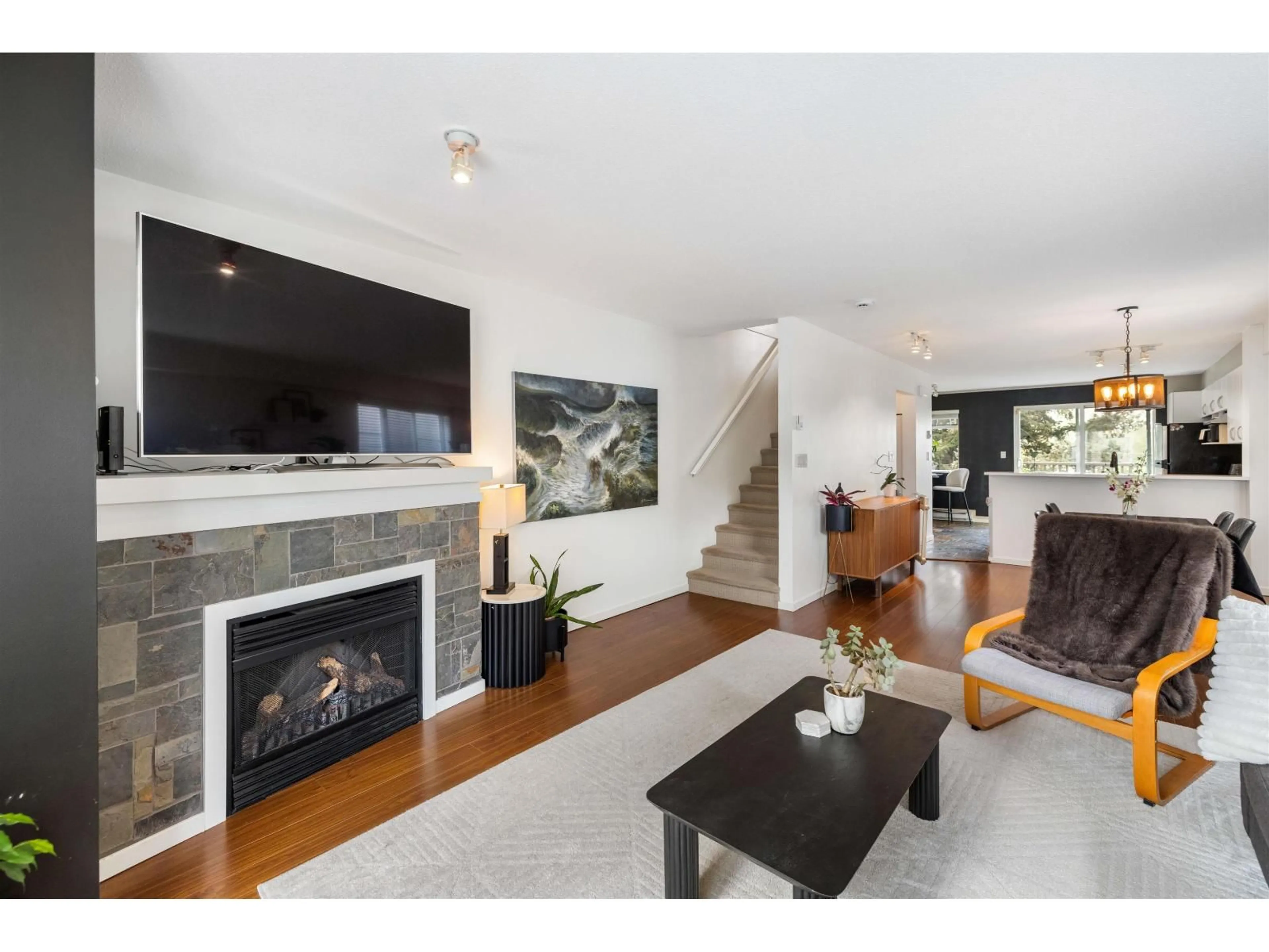Living room with furniture, wood/laminate floor for 102 - 15175 62A AVENUE, Surrey British Columbia V3S1X1