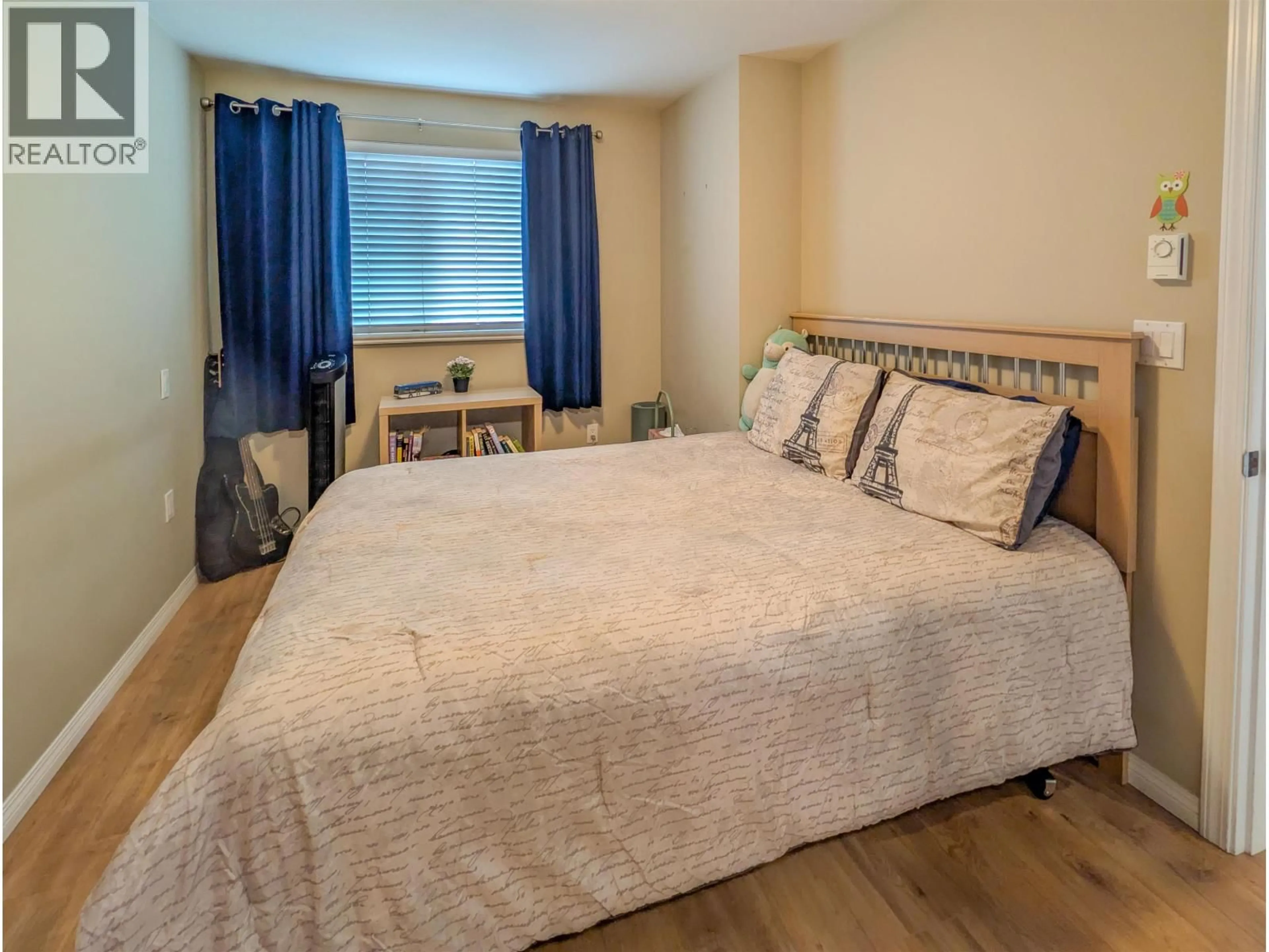 Bedroom with bed, wood/laminate floor for 204 - 5000 IMPERIAL STREET, Burnaby British Columbia V5J1C8