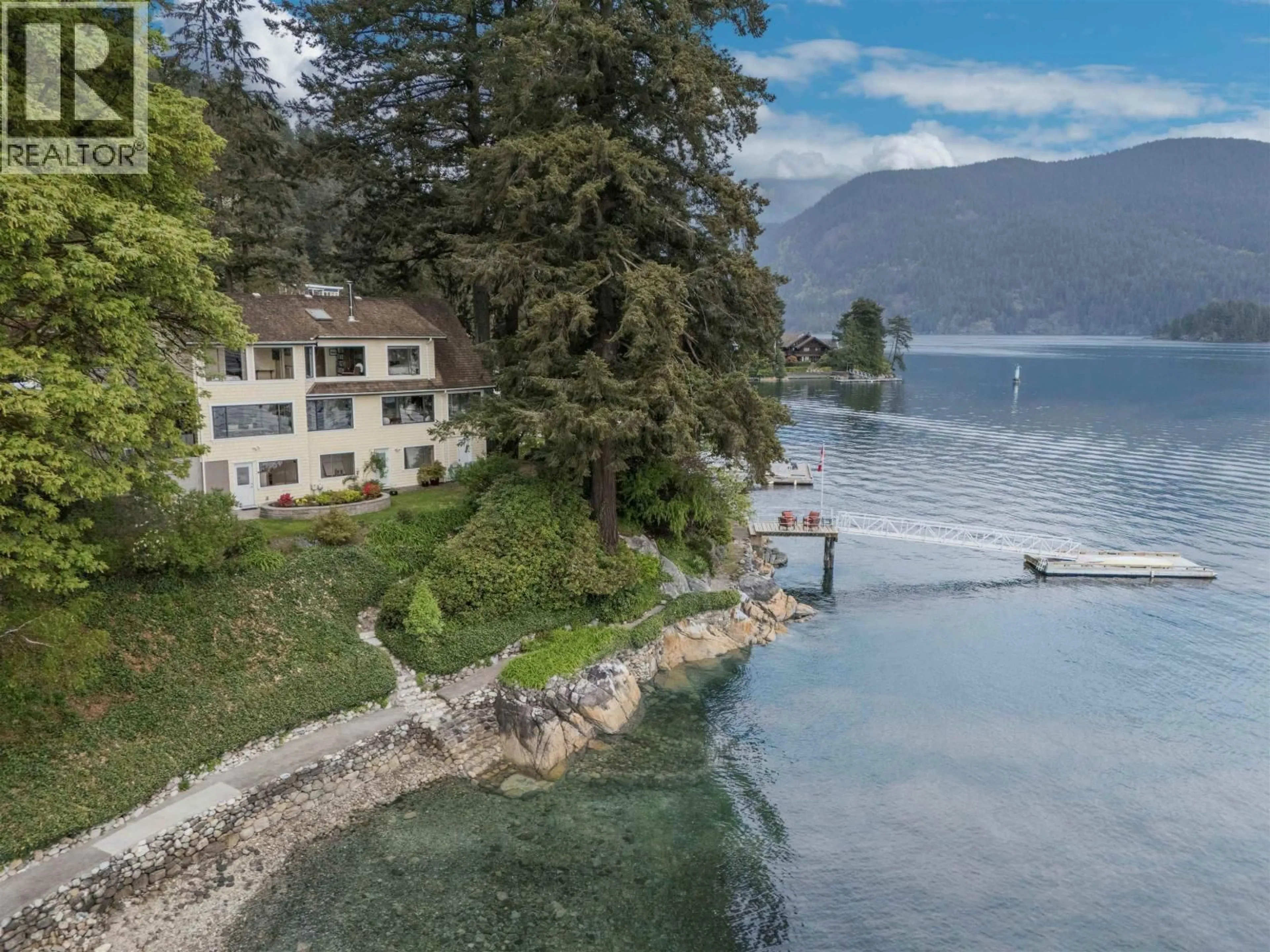 A pic from outside/outdoor area/front of a property/back of a property/a pic from drone, water/lake/river/ocean view for 5445 INDIAN RIVER DRIVE, North Vancouver British Columbia V7G2T7
