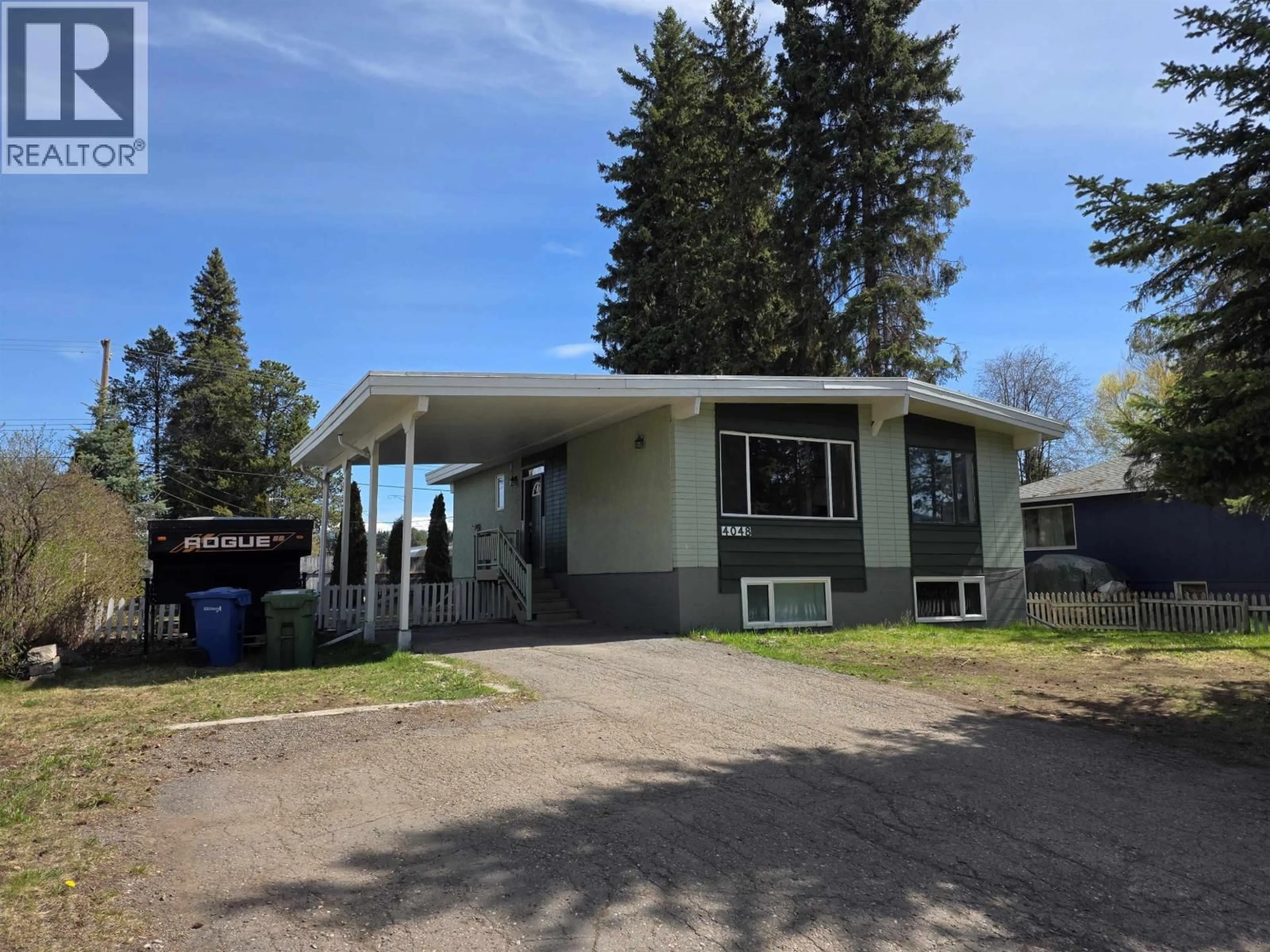 Home with vinyl exterior material, street for 4048 FOURTH AVENUE, Smithers British Columbia V0J2N0