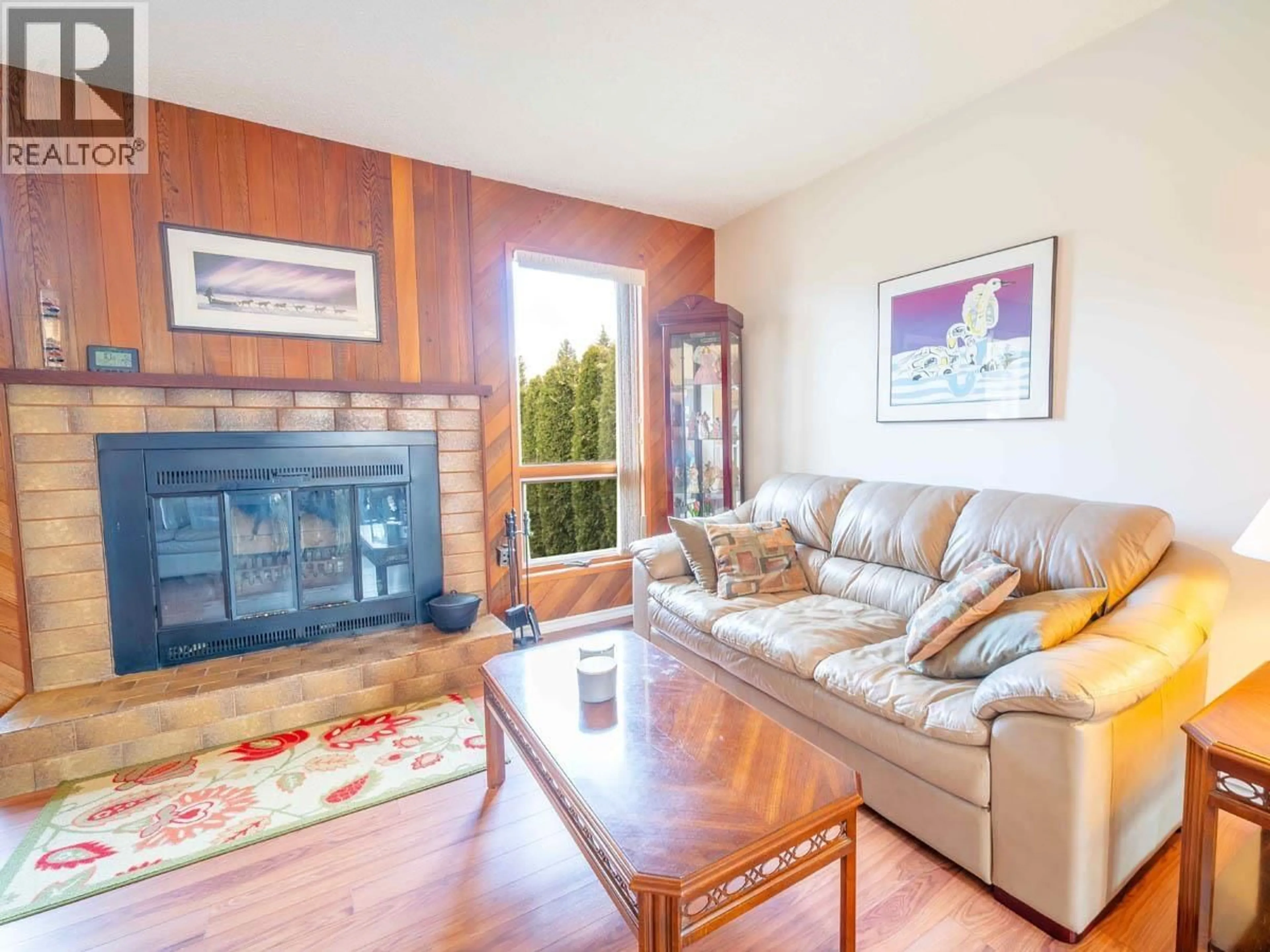 Living room with furniture, wood/laminate floor for 8129 ST LAWRENCE AVENUE, Prince George British Columbia V2N4K6
