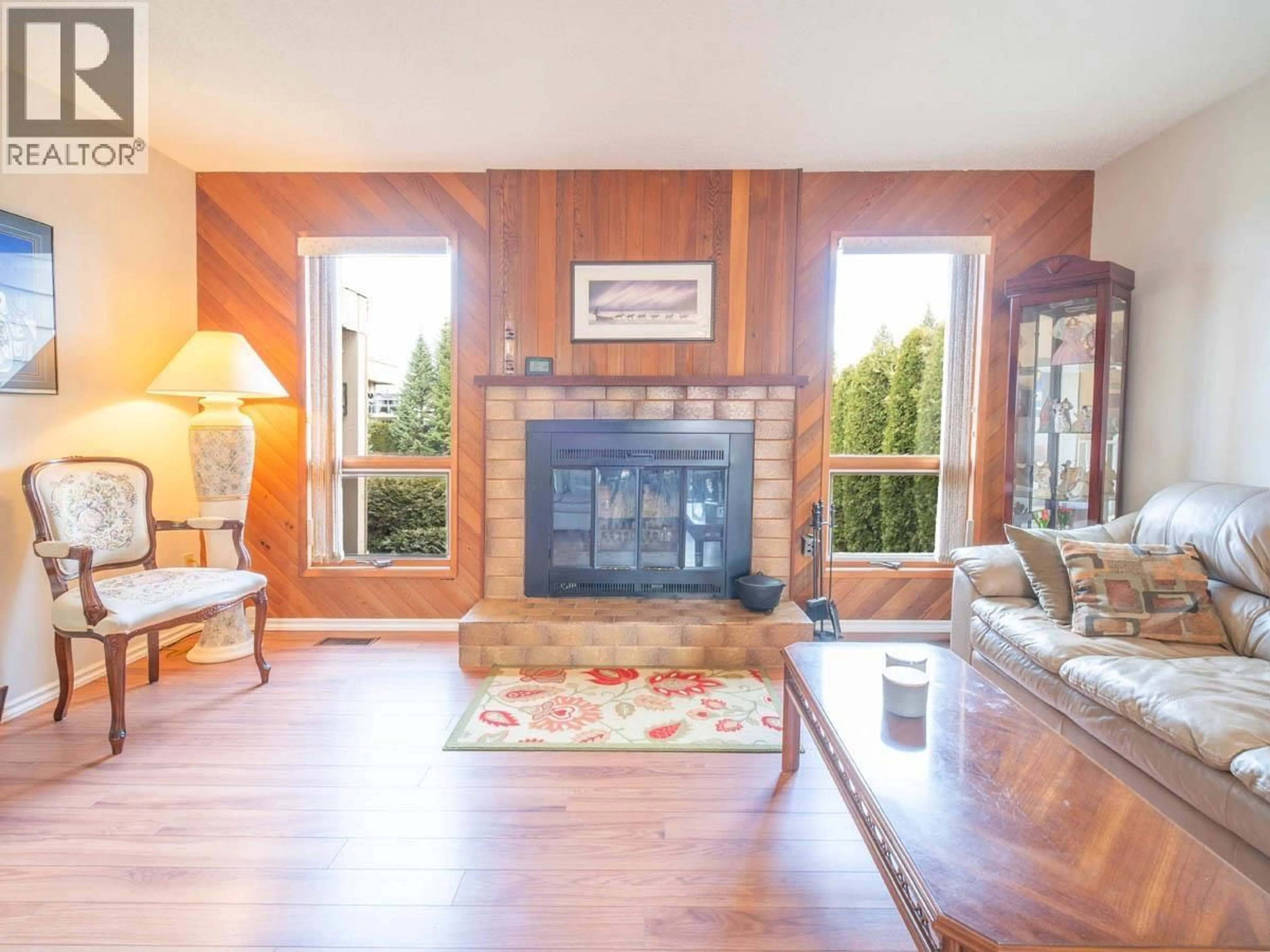 Living room with furniture, wood/laminate floor for 8129 ST LAWRENCE AVENUE, Prince George British Columbia V2N4K6
