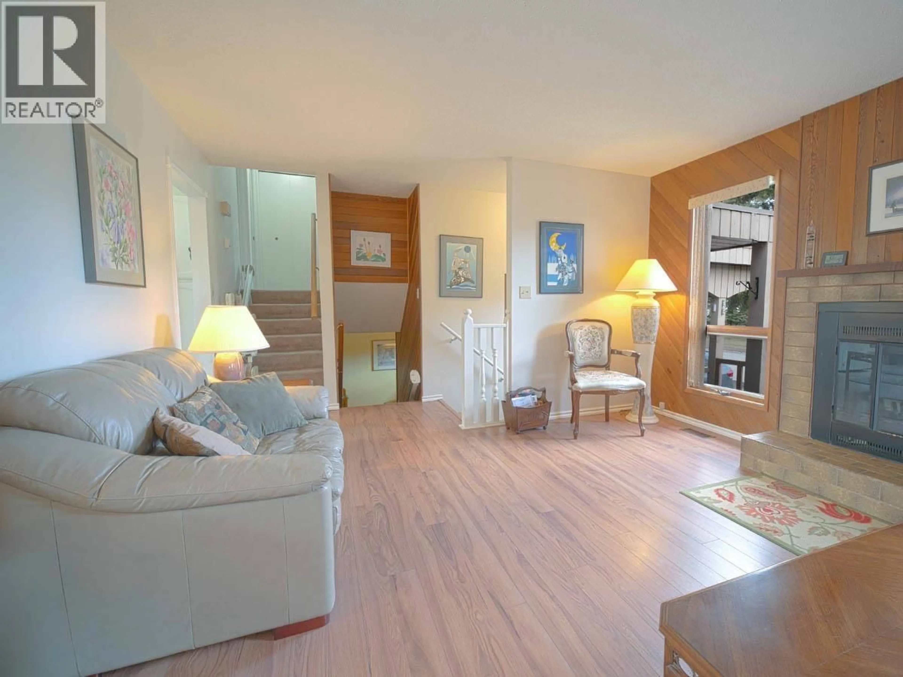 Living room with furniture, wood/laminate floor for 8129 ST LAWRENCE AVENUE, Prince George British Columbia V2N4K6