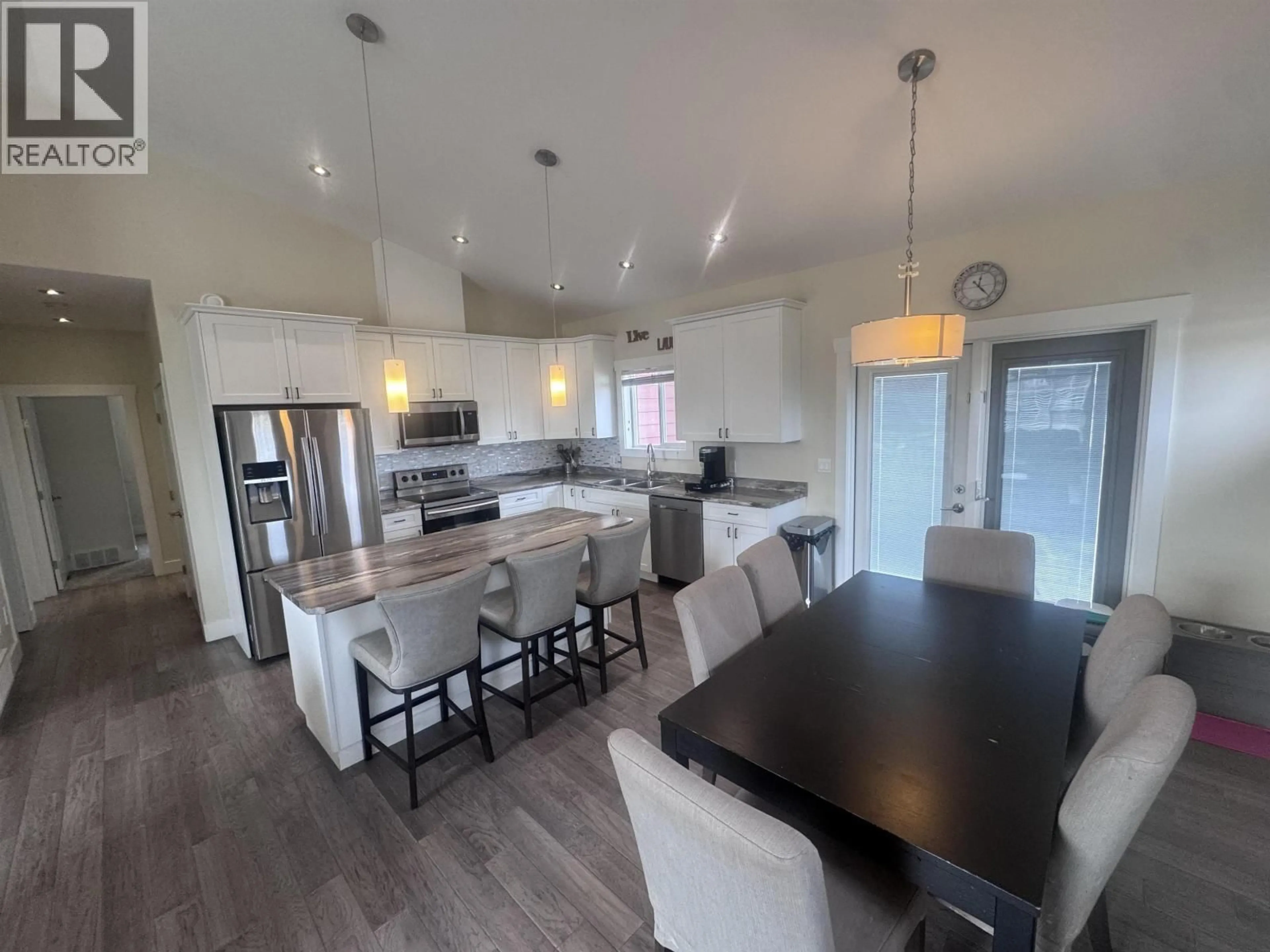 Open concept kitchen, wood/laminate floor for 10616 110 STREET, Fort St. John British Columbia V1J0N3